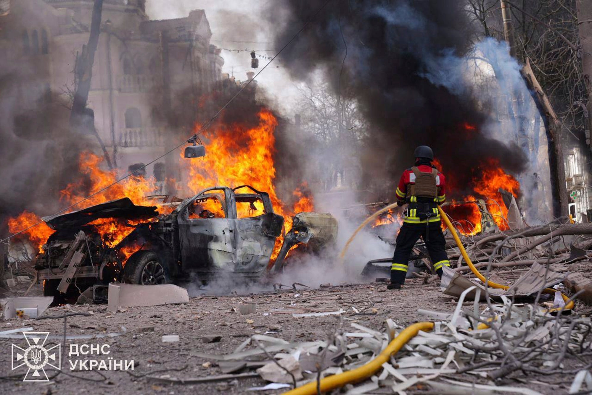 In this photo provided by the Ukrainian Emergency Service, firefighters put out the fire following Russia's missile attack that killed at least 20 civilians in Sumy, Ukraine, Sunday, April 13, 2025. (Ukrainian Emergency Service via AP)