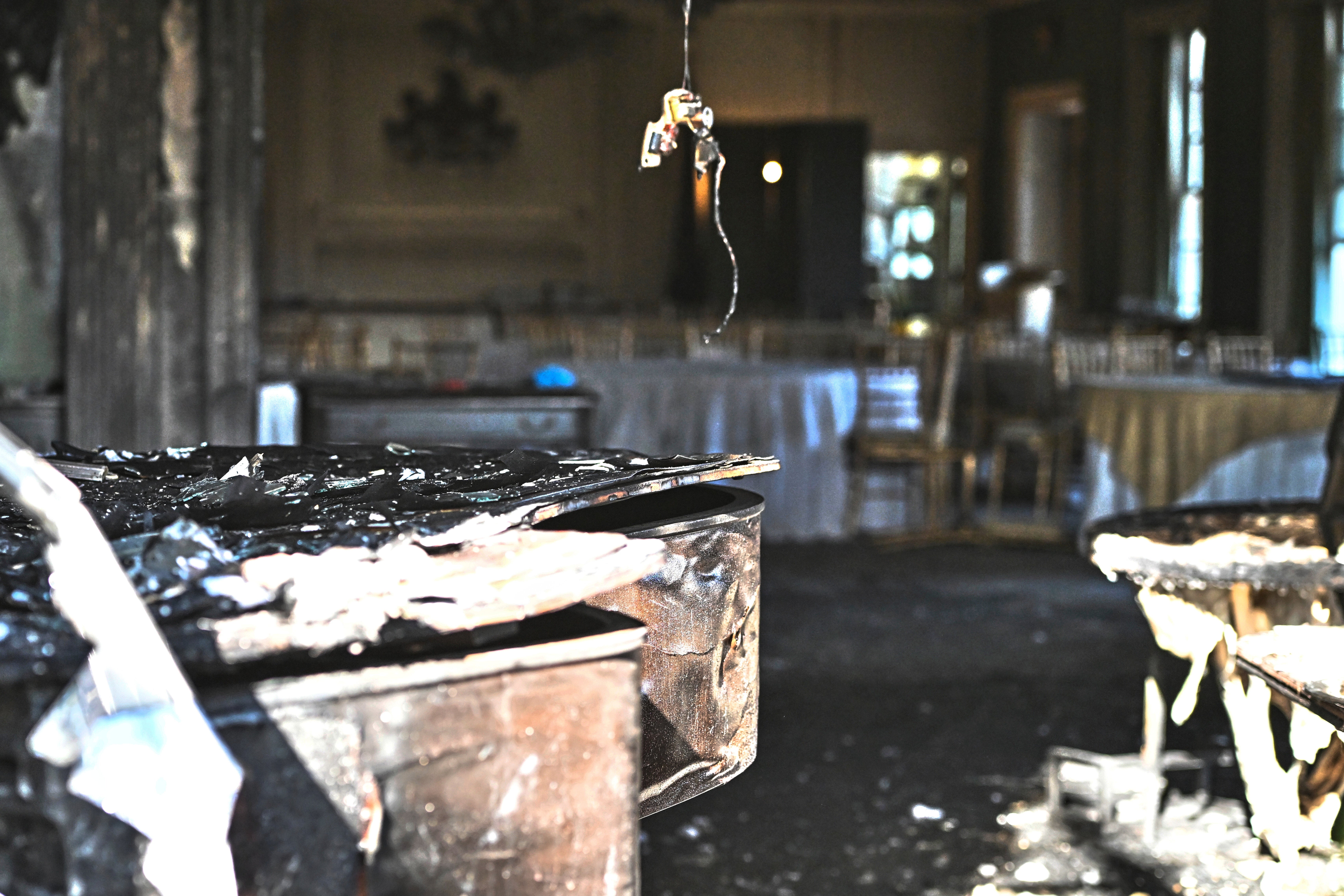 A charred piano, left, is visible inside the Pennsylvania governor's official residence after a man was arrested in the alleged arson that forced Gov. Shapiro, his family and guests to flee in the middle of the night on the Jewish holiday of Passover, Sunday, Apr. 13, 2025, in Harrisburg, Pa. (AP Photo/Marc Levy)