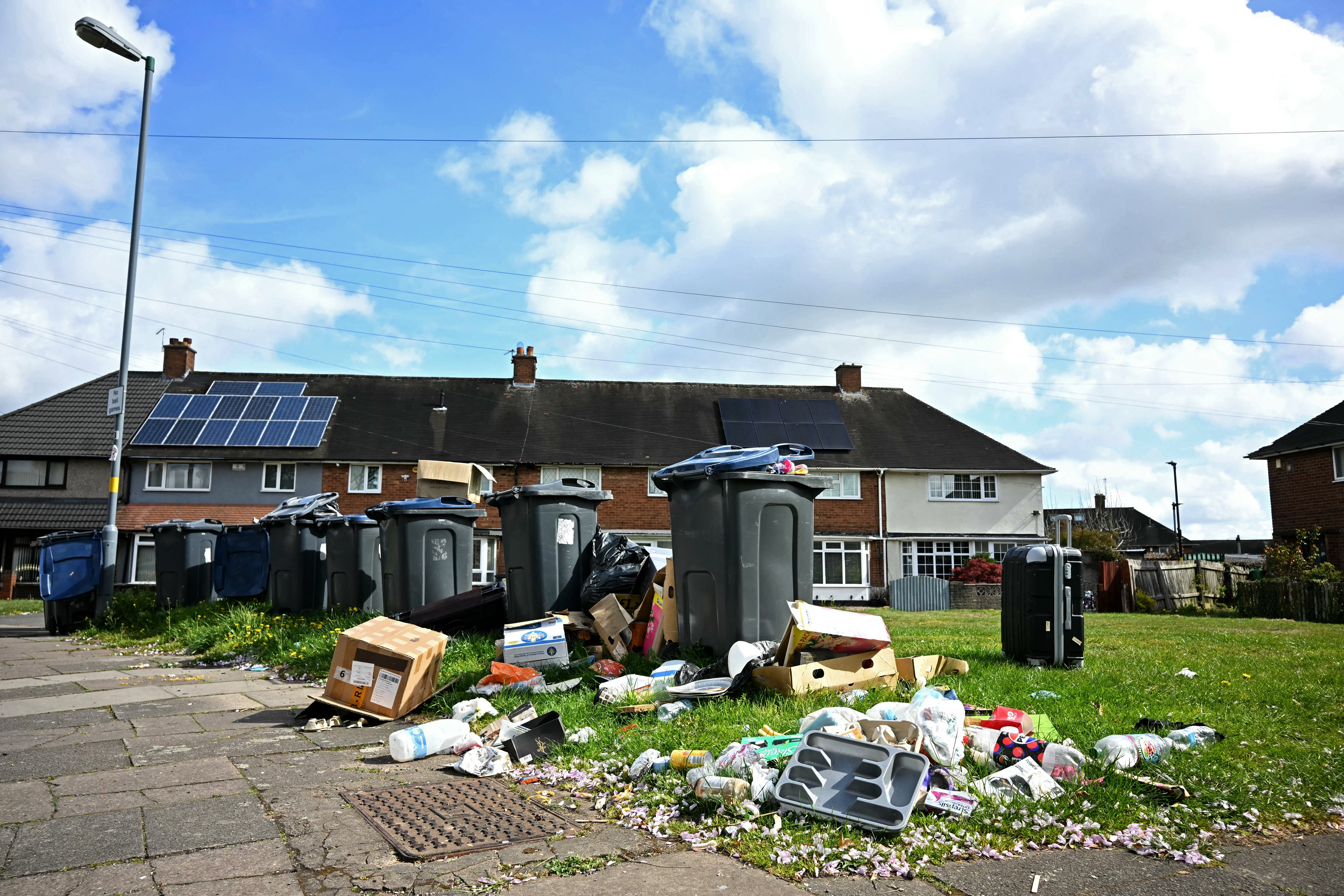 Waste overflowing from wheelie bins