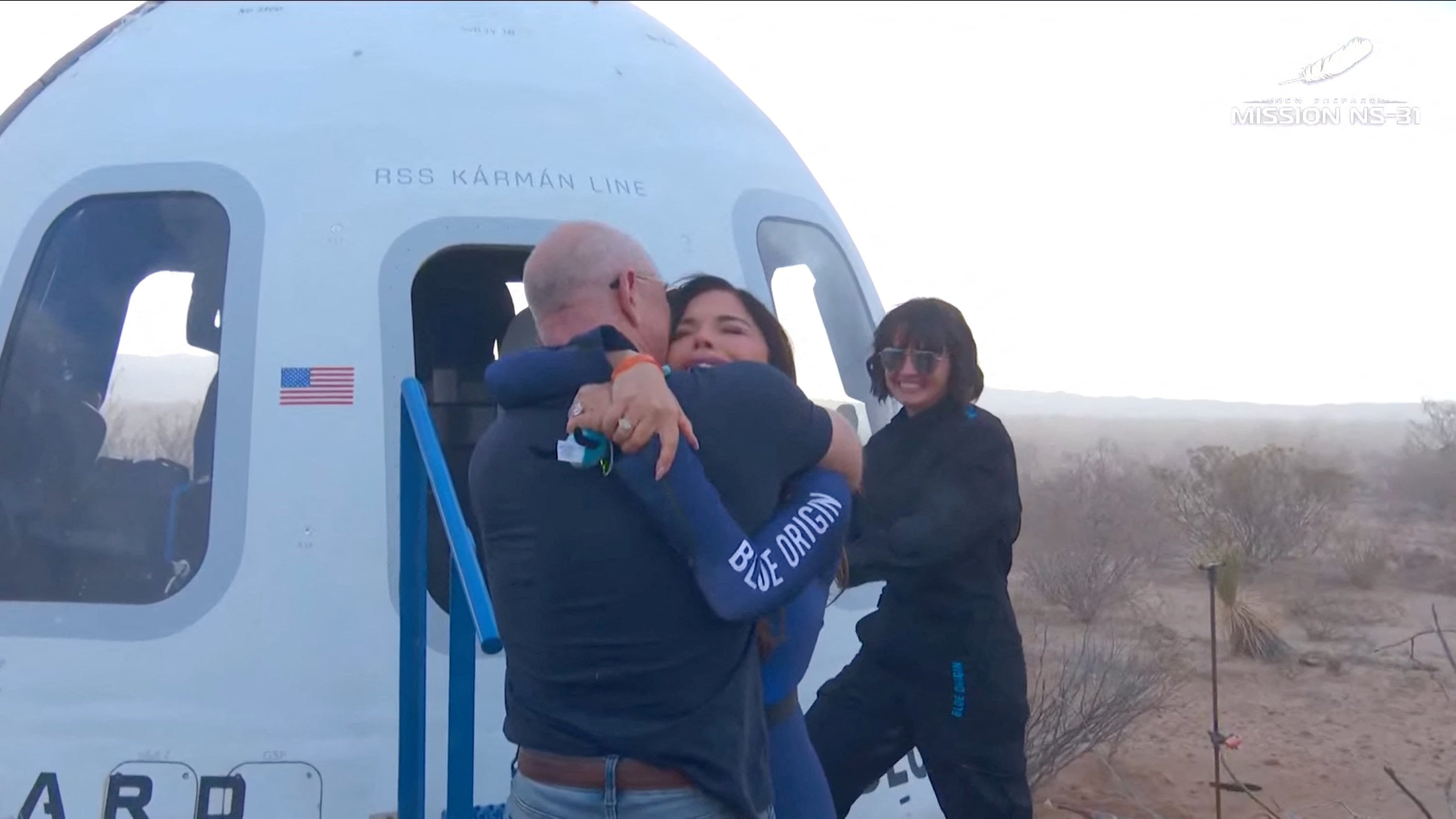 Lauren Sanchez embraces Jeff Bezos after her brief trip to space. She joked that she had to return to Earth because of the pair’s upcoming wedding