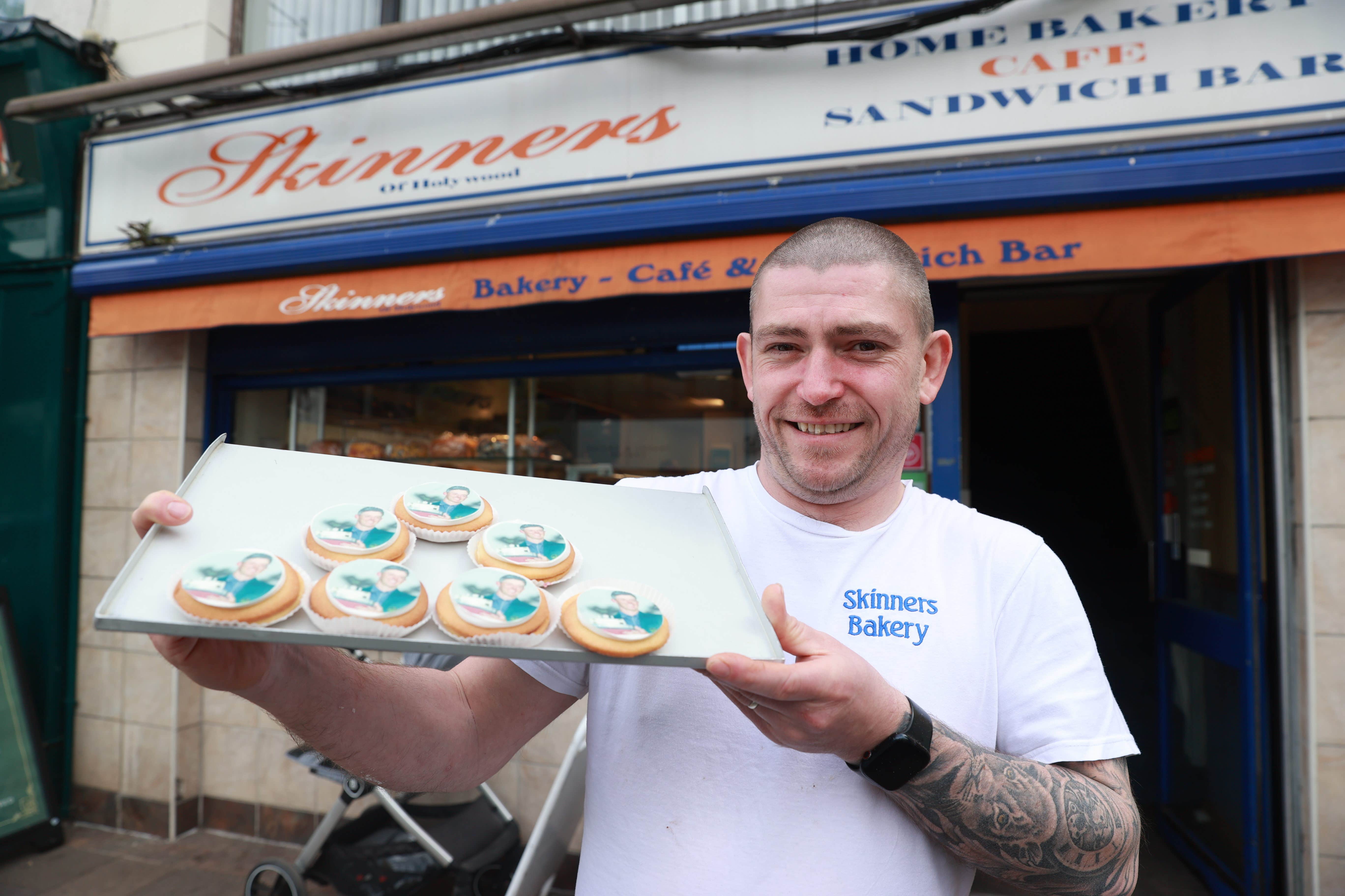 Graham McMorris of Skinners Bakery in Holywood, Co Down, with his German biscuits with an image of Rory McIlroy’s face printed onto sugar paper, to celebrate his victory in the Masters golf tournament (Liam McBurney/PA)