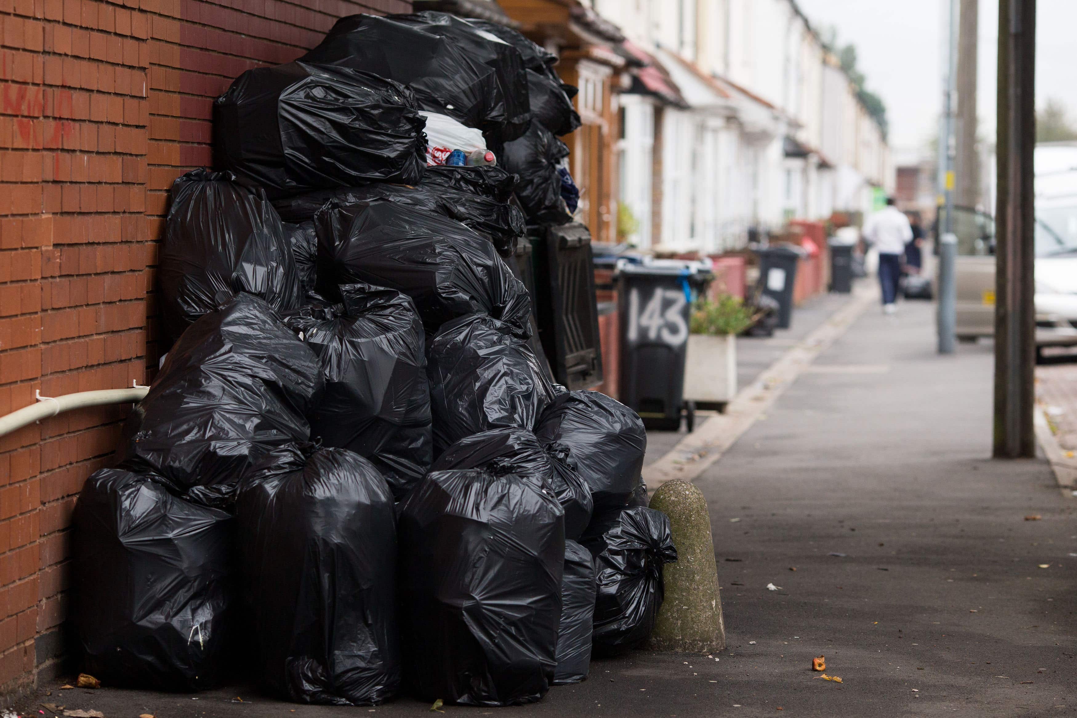 Rubbish bags piled up in front of bins in Moseley Road, Birmingham (Aaron Chown/PA)