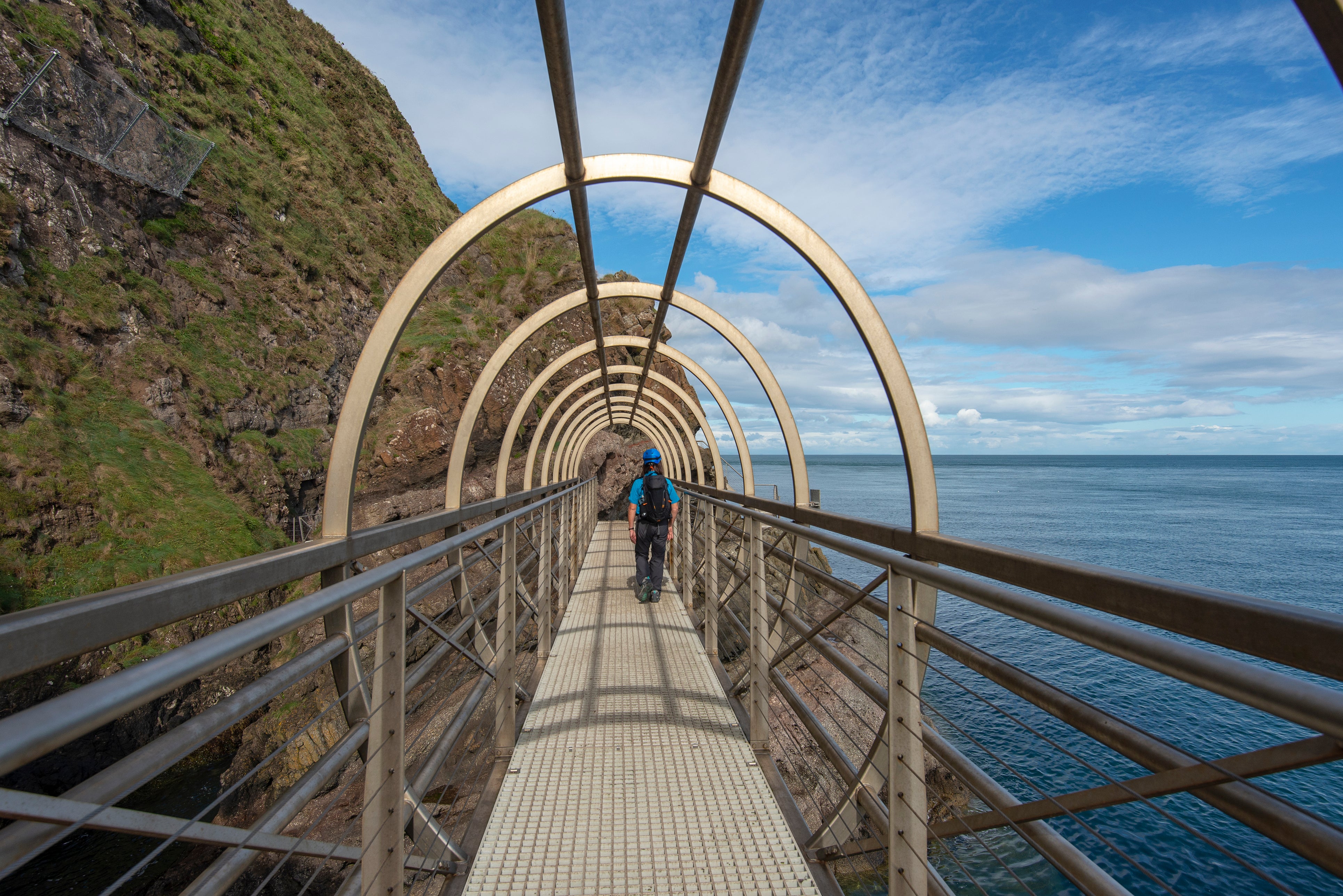 The three-mile Gobbins Cliff Walk allows visitors to walks next to the basalt cliffs over the Irish Sea