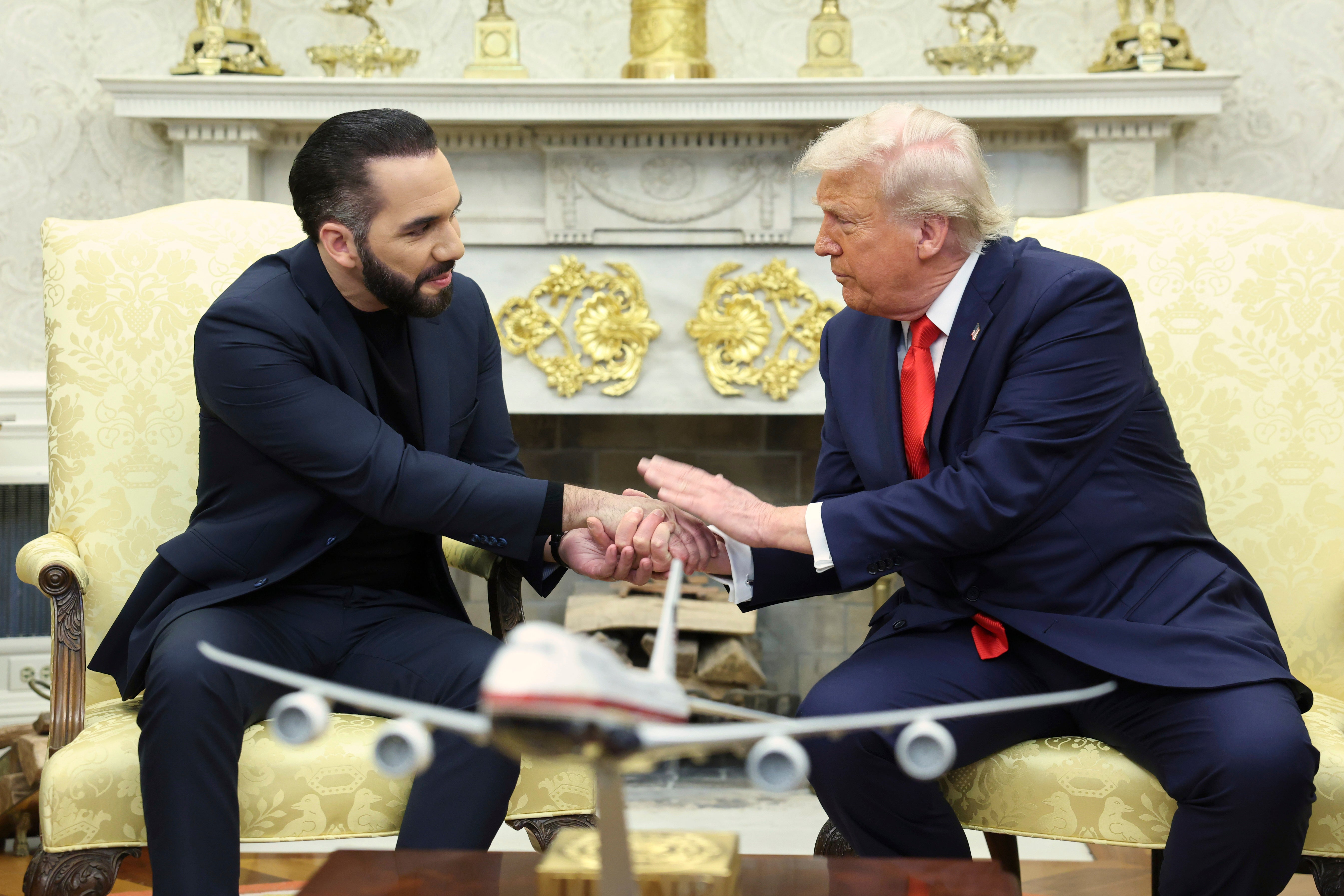 Trump shakes hands with El Salvador's President Nayib Bukele during a meeting in the Oval Office
