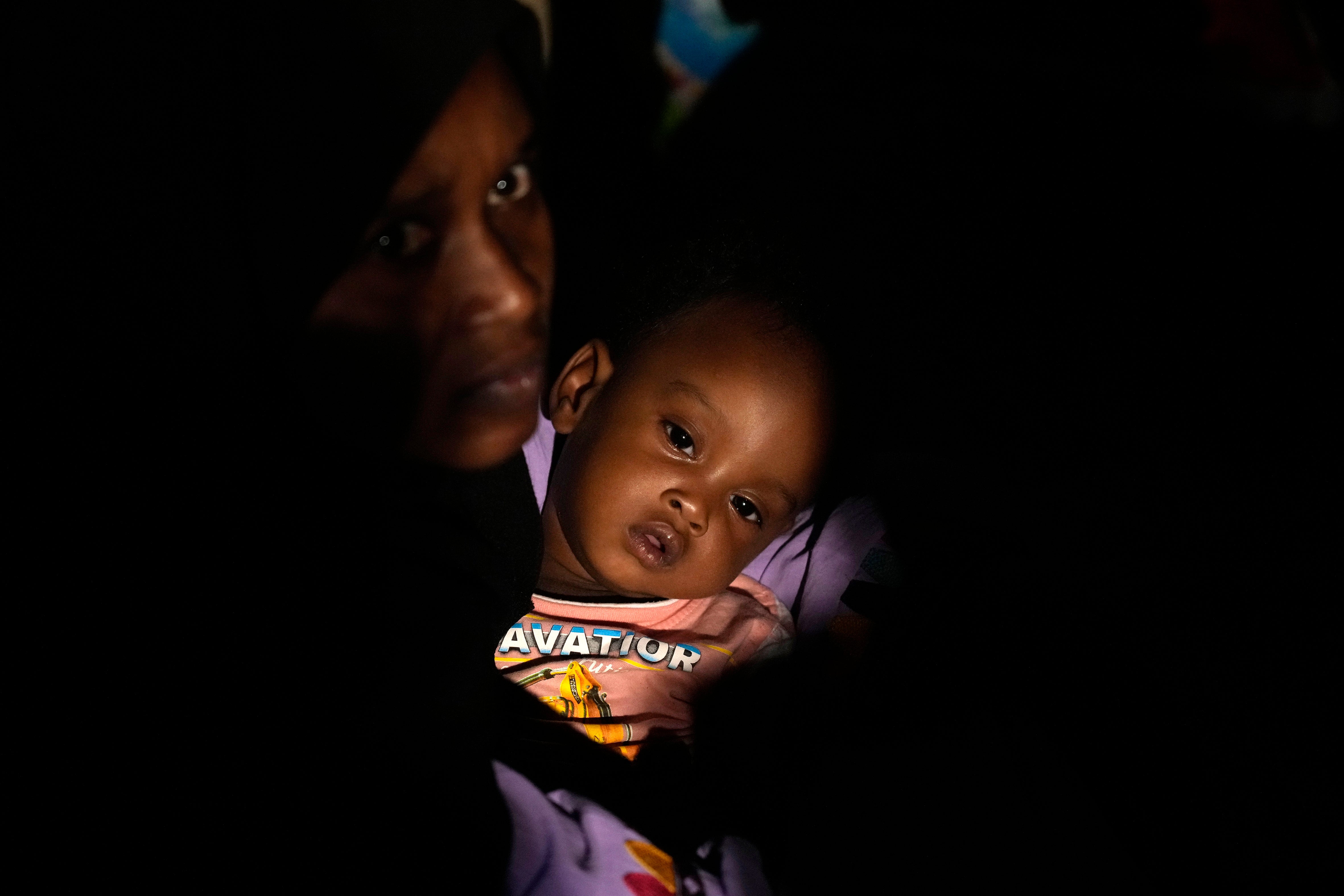 Sudanese evacuees wait to board a Saudi military ship in 2023