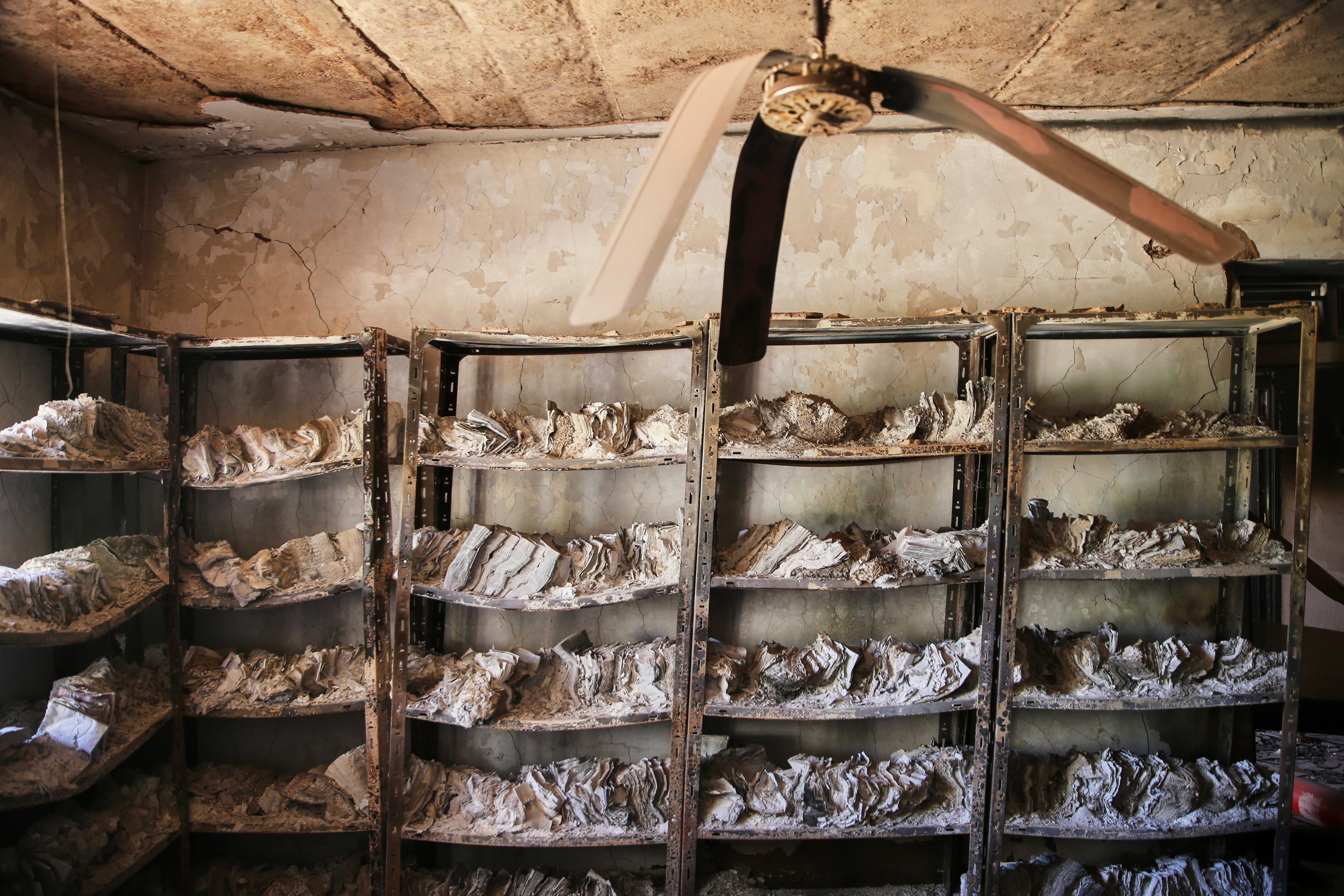 Burned documents left on shelves at the Republican Palace, following its recapture by Sudan’s army from the RSF in March