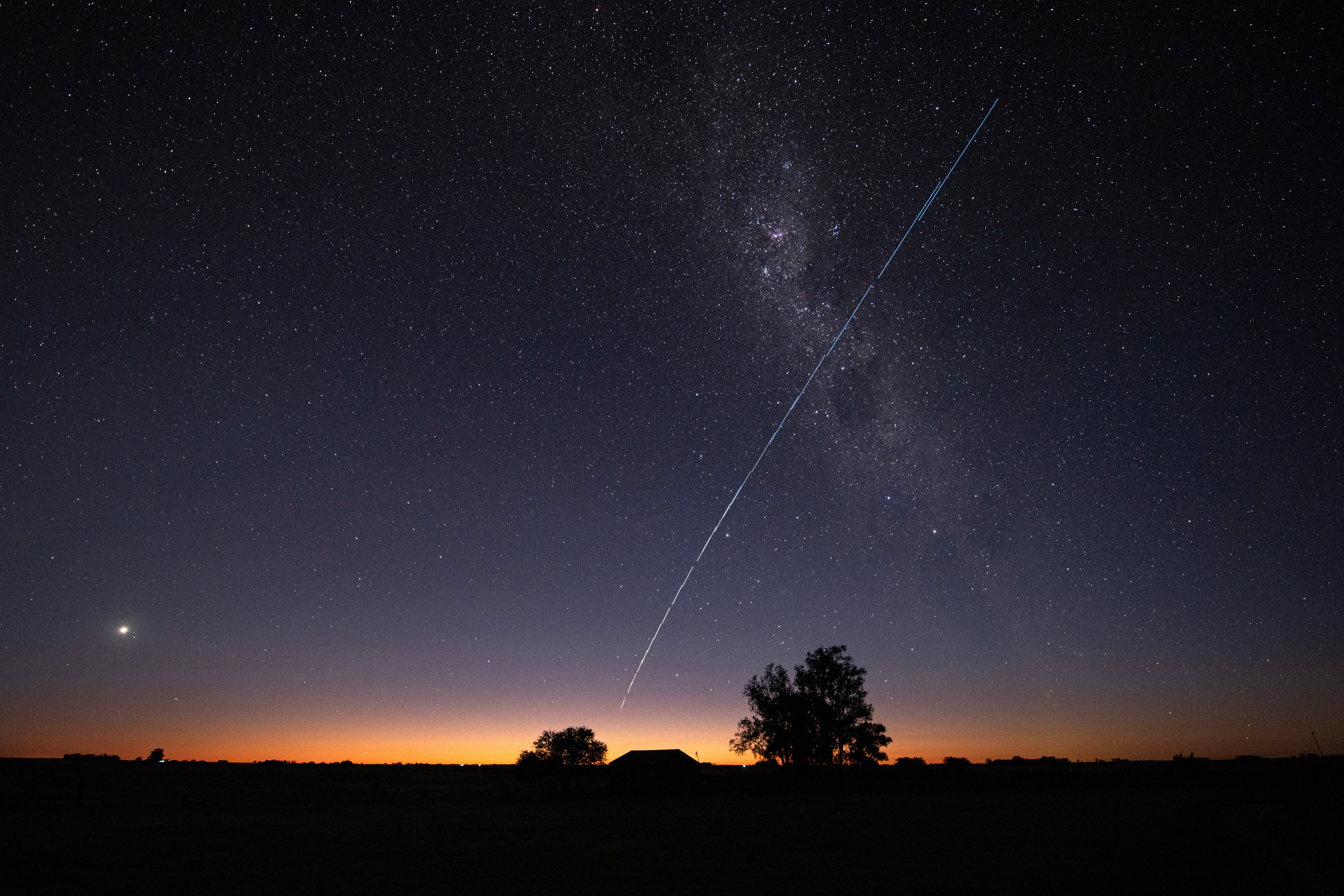 A group of SpaceX's Starlink G6-27 satellites passing over Uruguay in 2023. The satellites are promising to replace home internet connections
