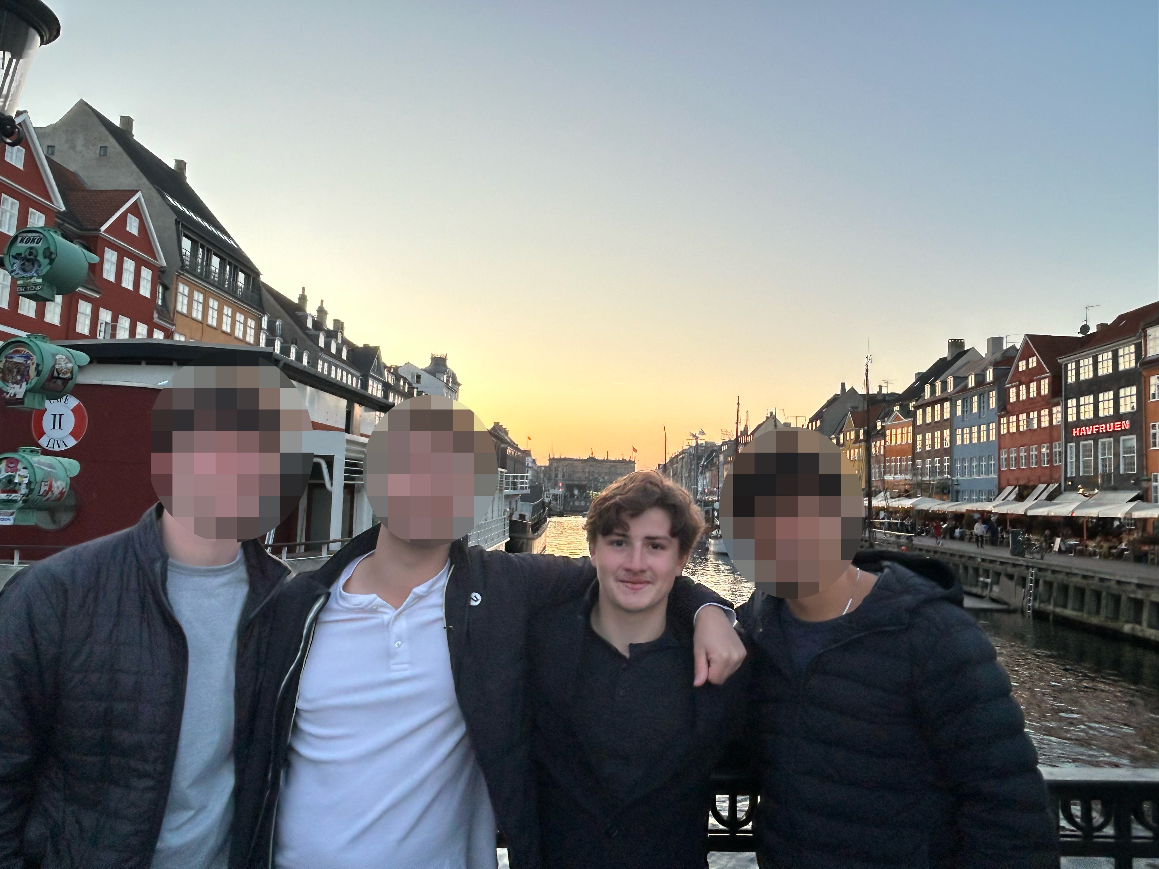 Owen Ray, 19, (second from right) was arrested and detained with a friend on April 1. They have now been released but are barred from leaving Denmark