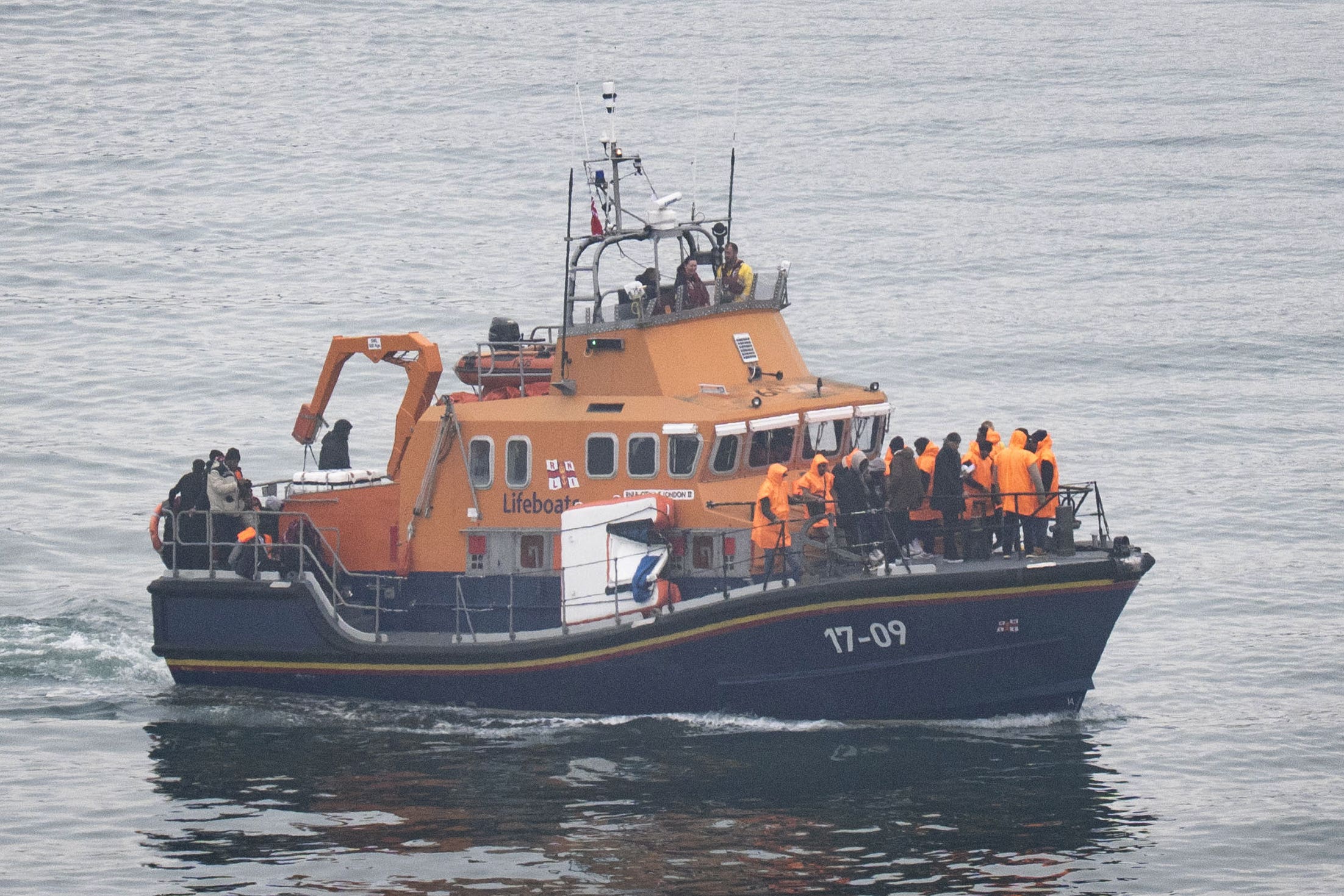 A group of people thought to be migrants are brought in to Dover, Kent, onboard an RNLI Lifeboat following a small boat incident in the Channel (Gareth Fuller/PA)