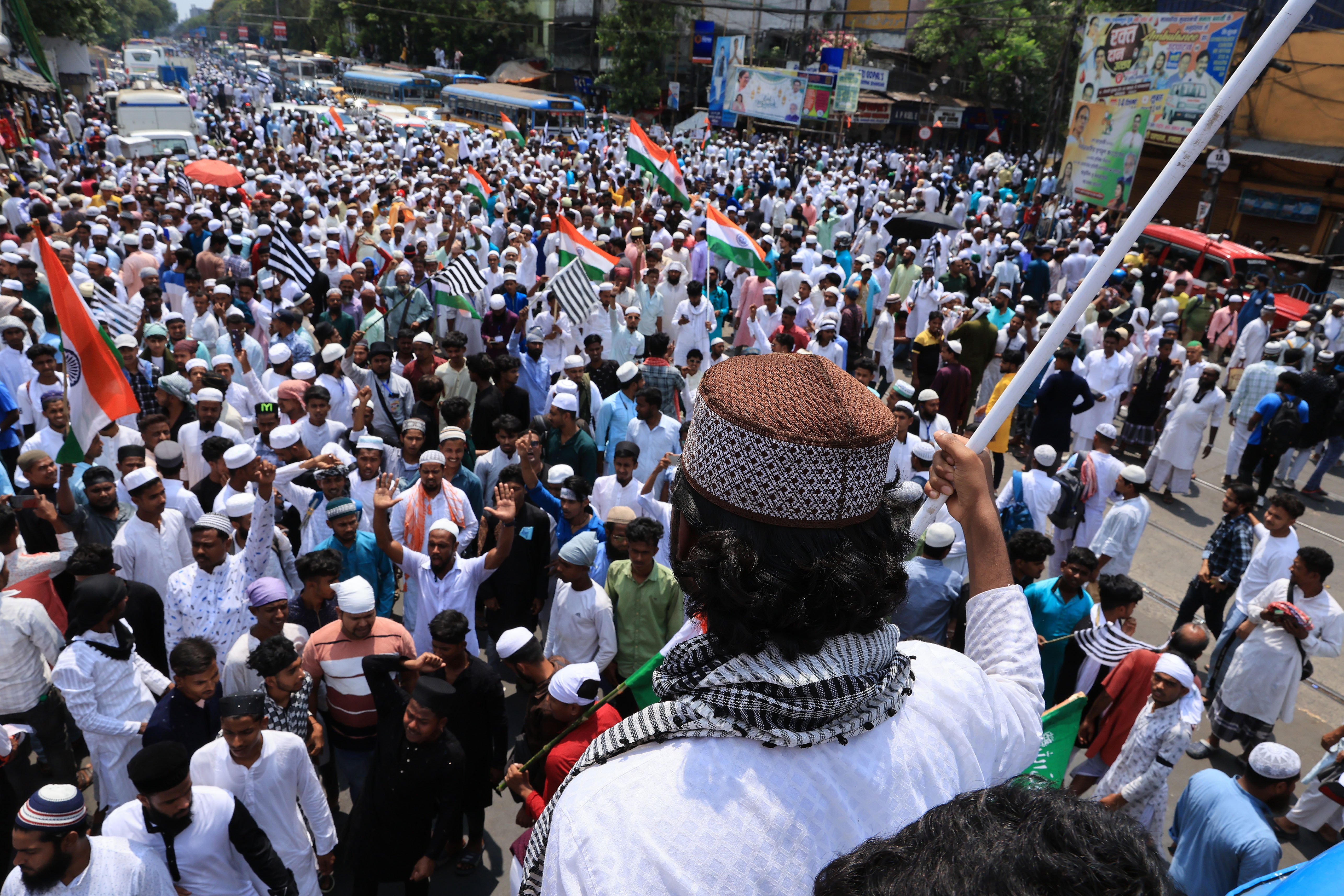 Protesters attend a march called by different Muslim organizations to protest against the recently passed Waqf (Amendment) Bill in Kolkata