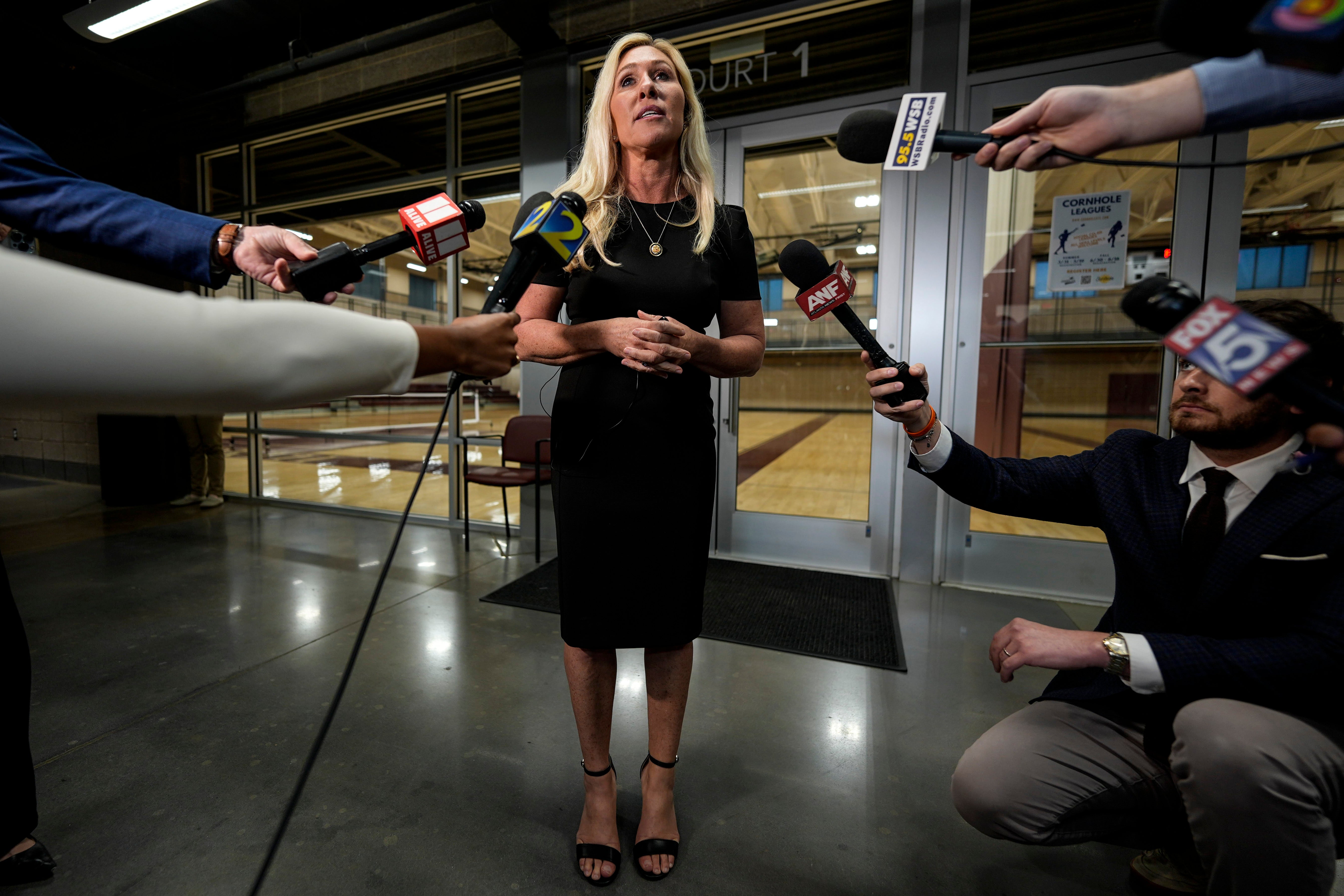 Greene speaks to reporters after her chaotic town hall