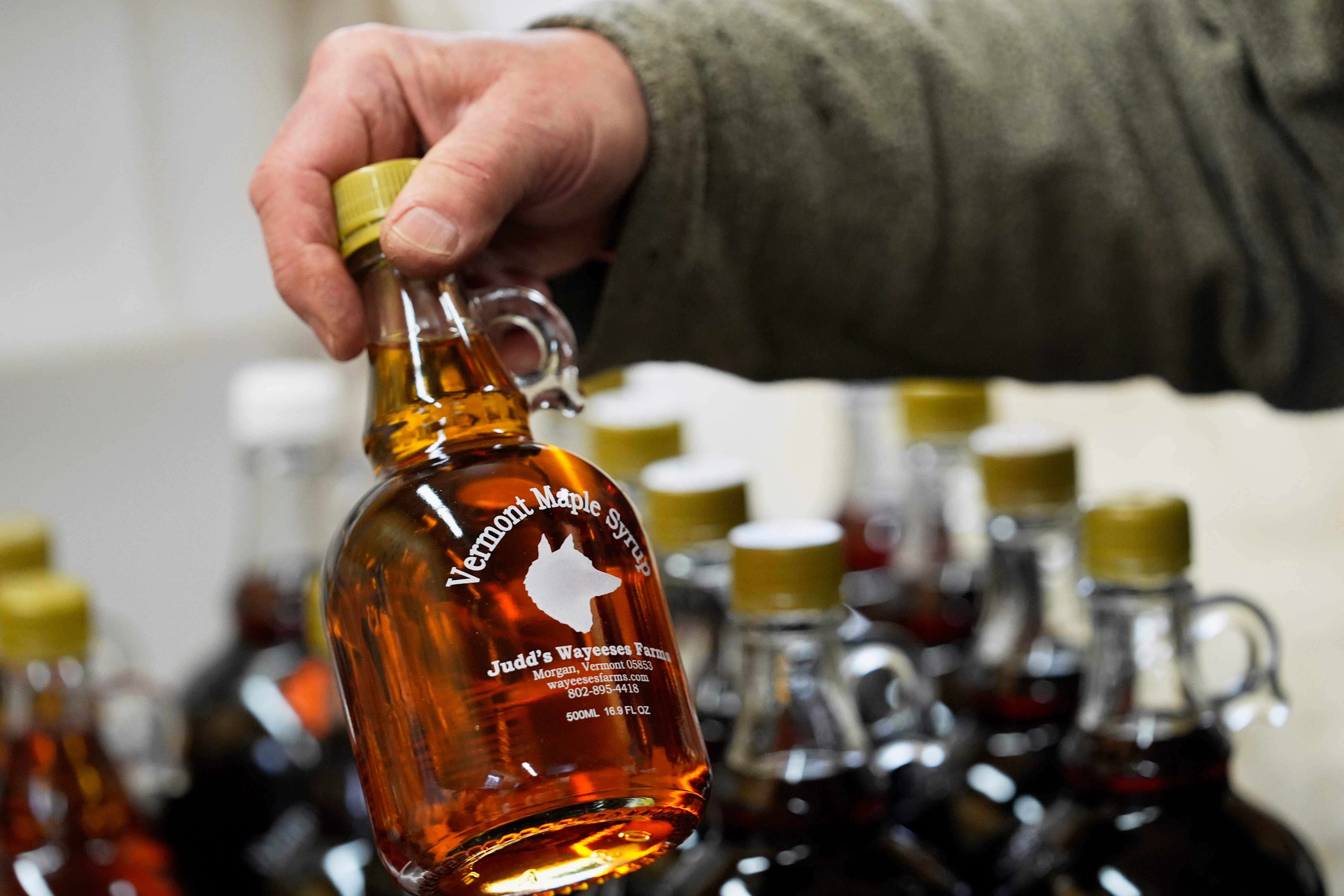 A bottle of maple syrup is placed on a shelf at Judd's Wayeeses Farms in Morgan, Vt., on Friday, April 11, 2025.
