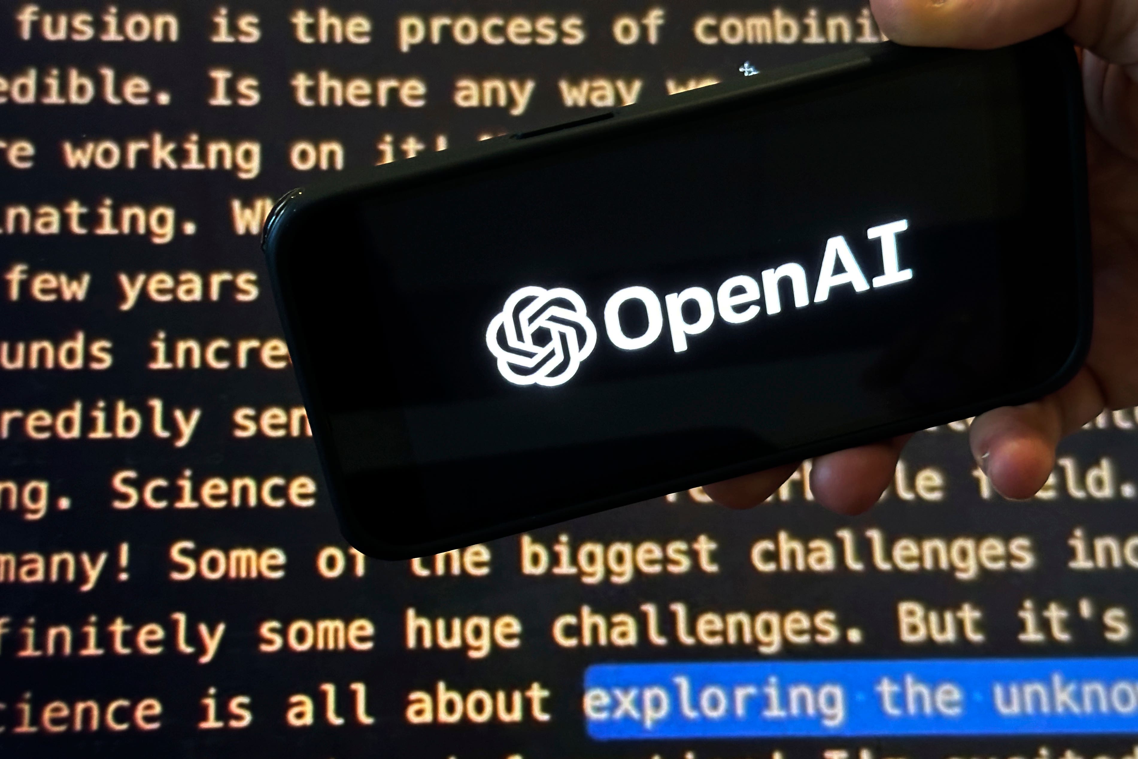 The OpenAI logo on a mobile phone (Peter Morgan/AP)