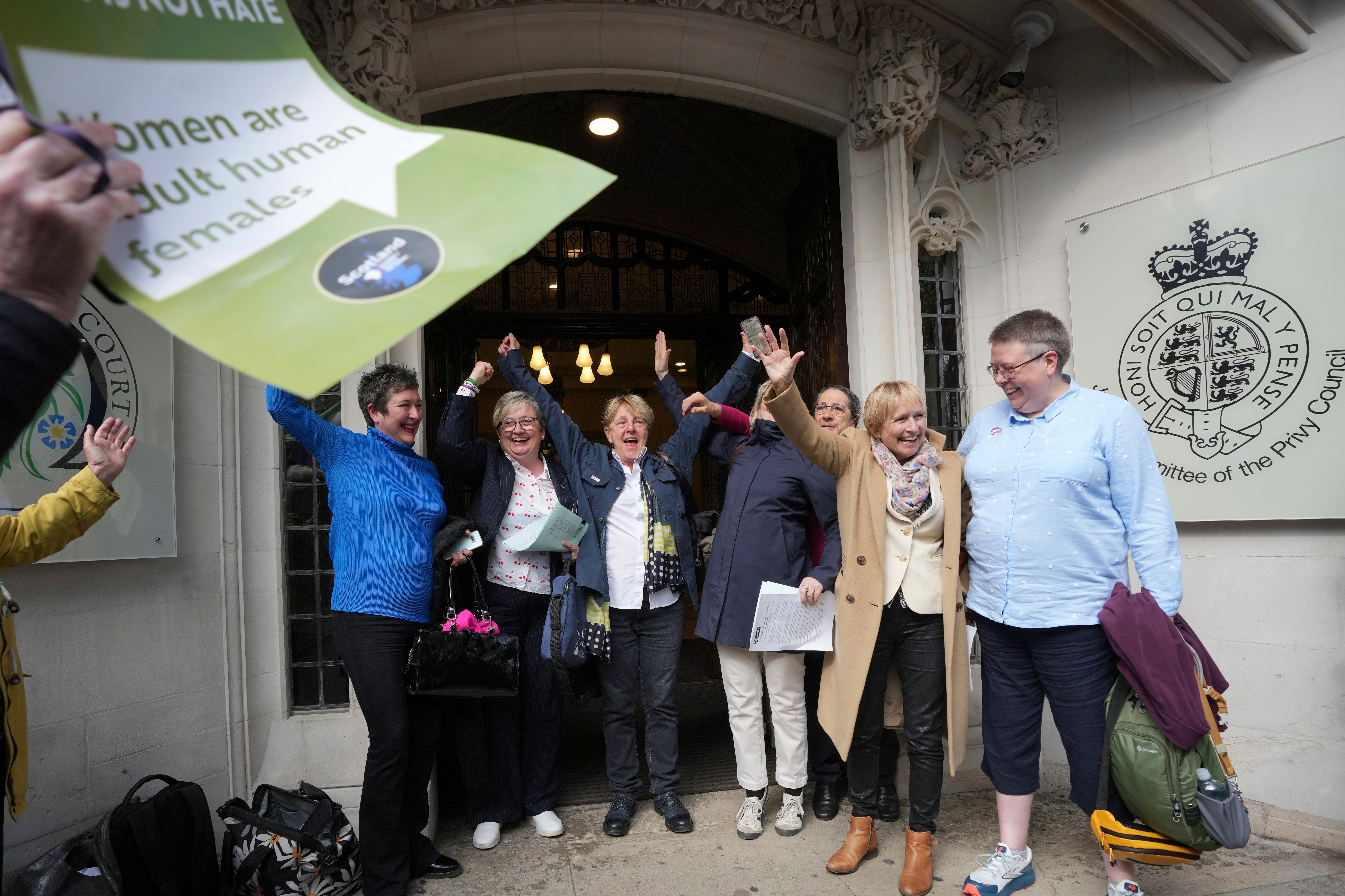 Women’s rights activists celebrate outside the Supreme Court