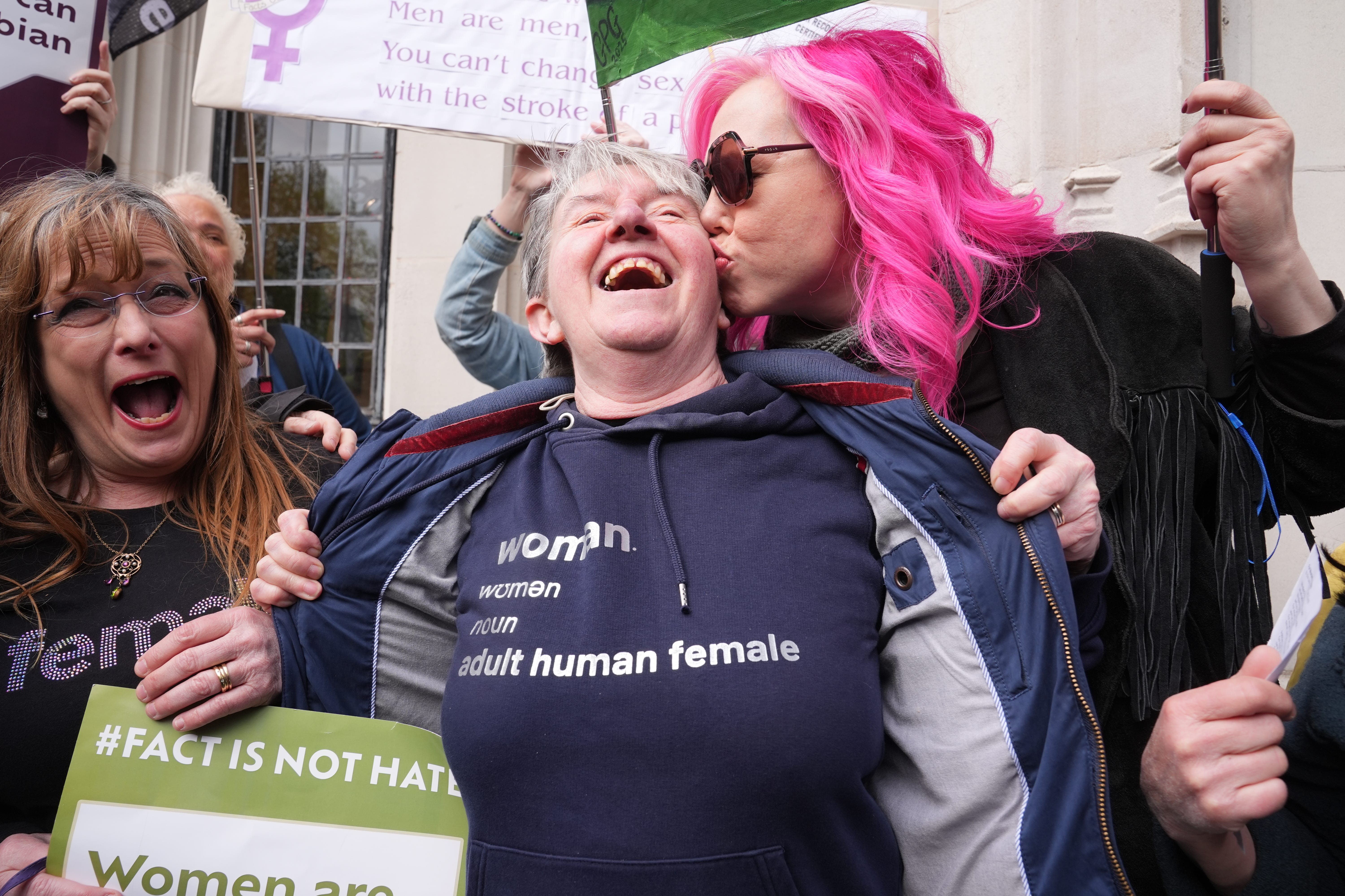 Campaigners for For Women Scotland celebrate the ruling outside the Supreme Court in London (Lucy North/PA)
