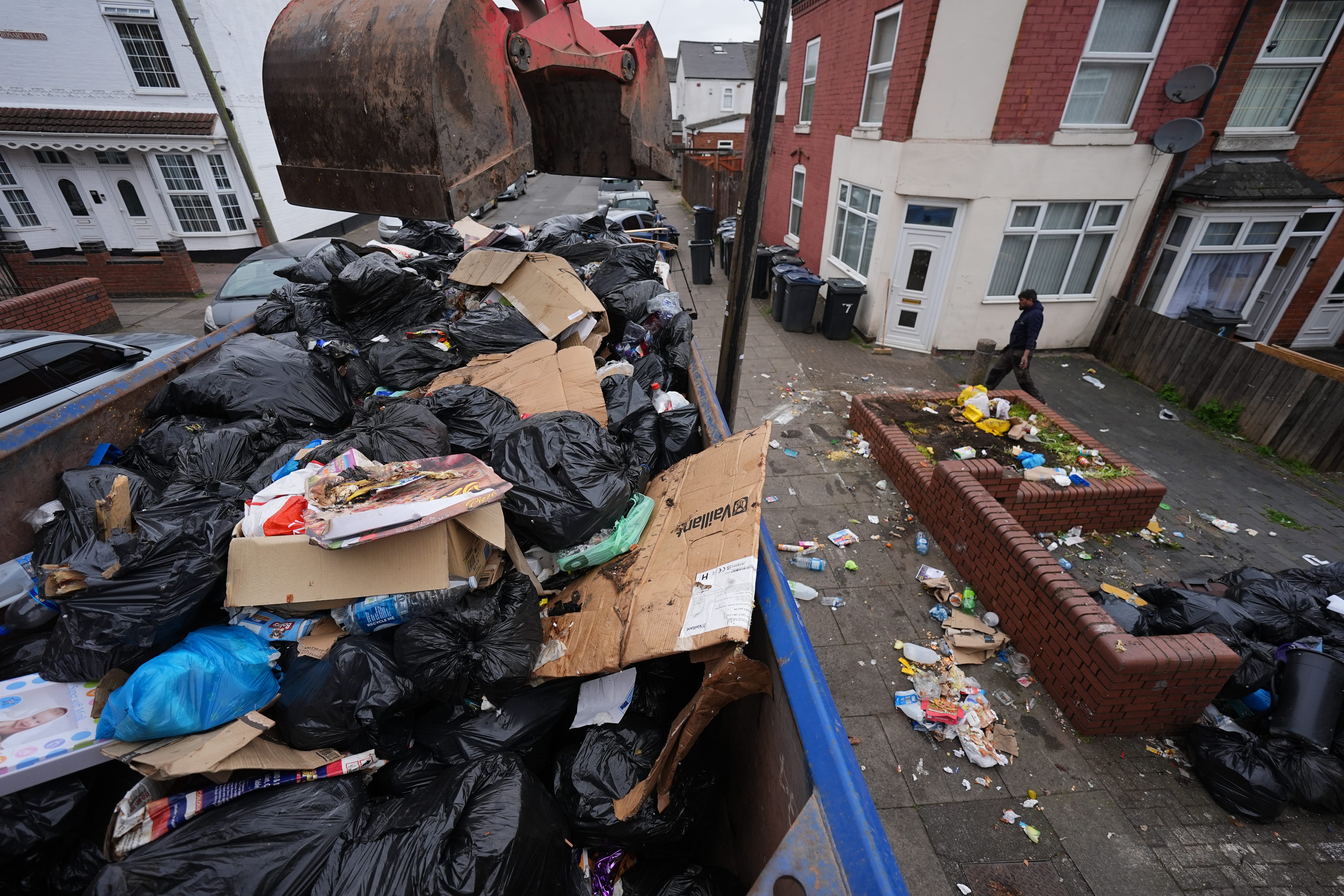 Rubbish bags are taken away on Poplar Road in Birmingham as talks to end the refuse worker strike were adjourned without agreement on Wednesday (Jacob King/PA)