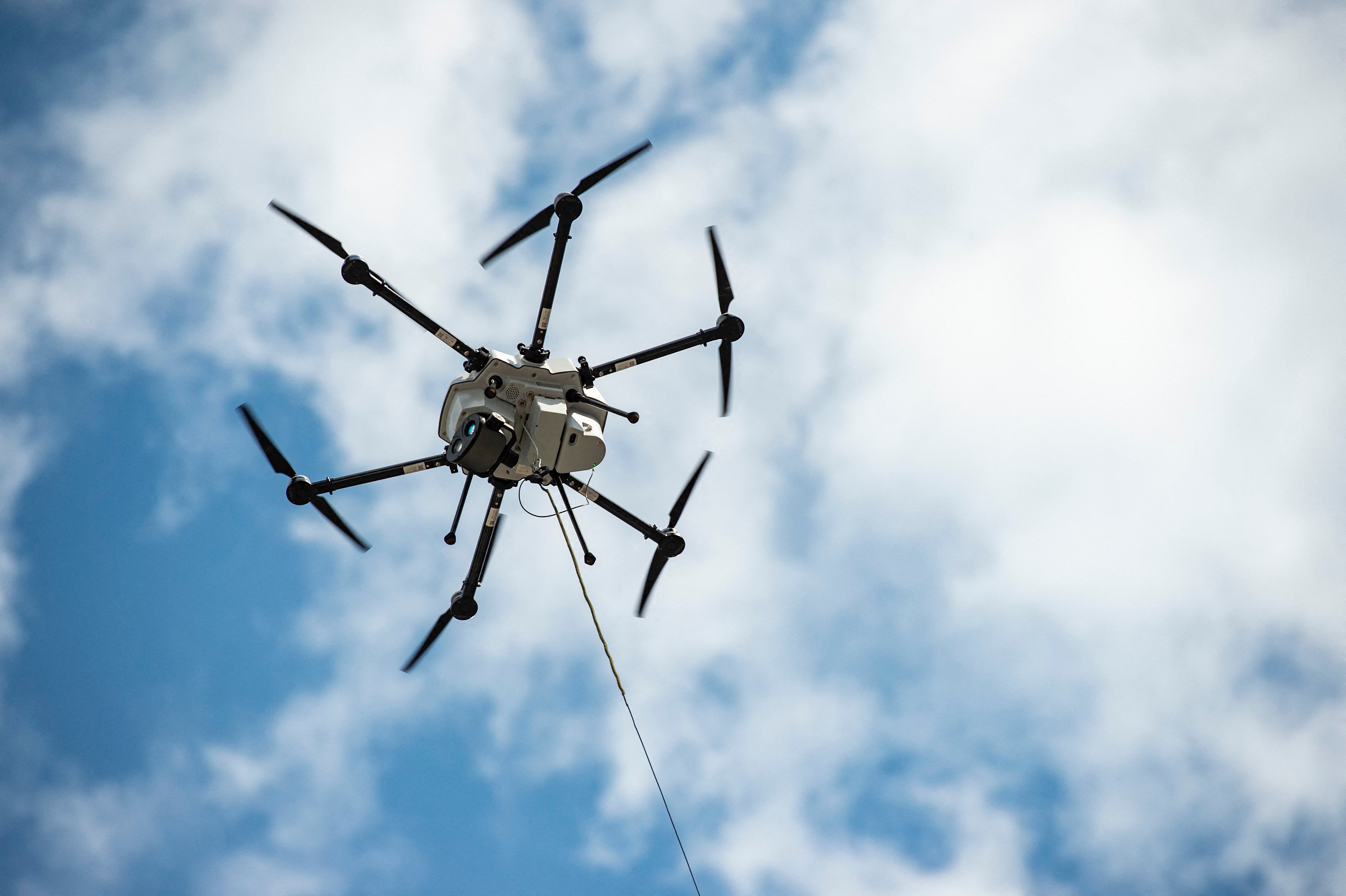 A tethered drone shows off its unlimited flight time at an event in Boston, Massachusetts