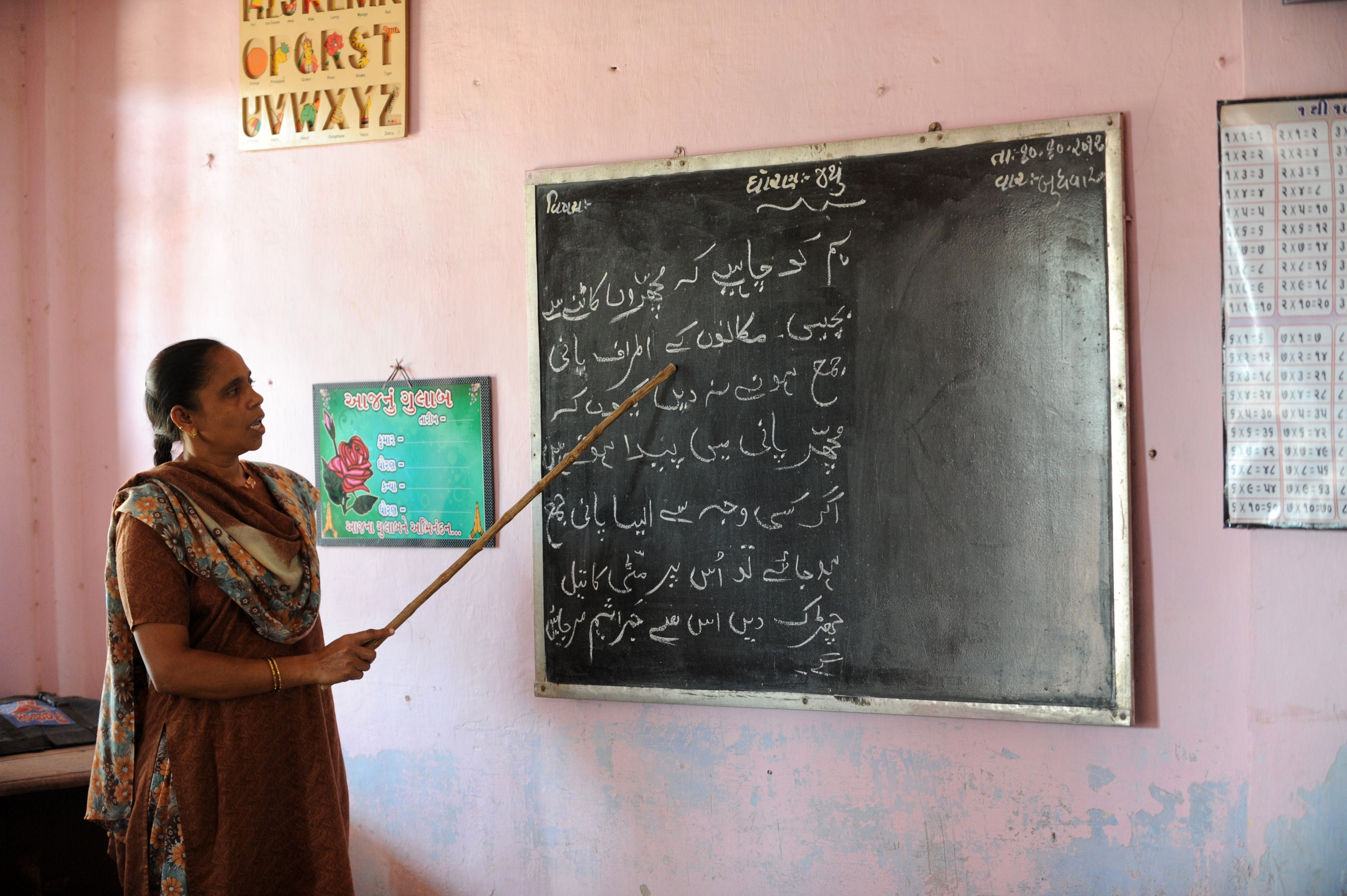 File. Teacher gives lessons in Urdu language