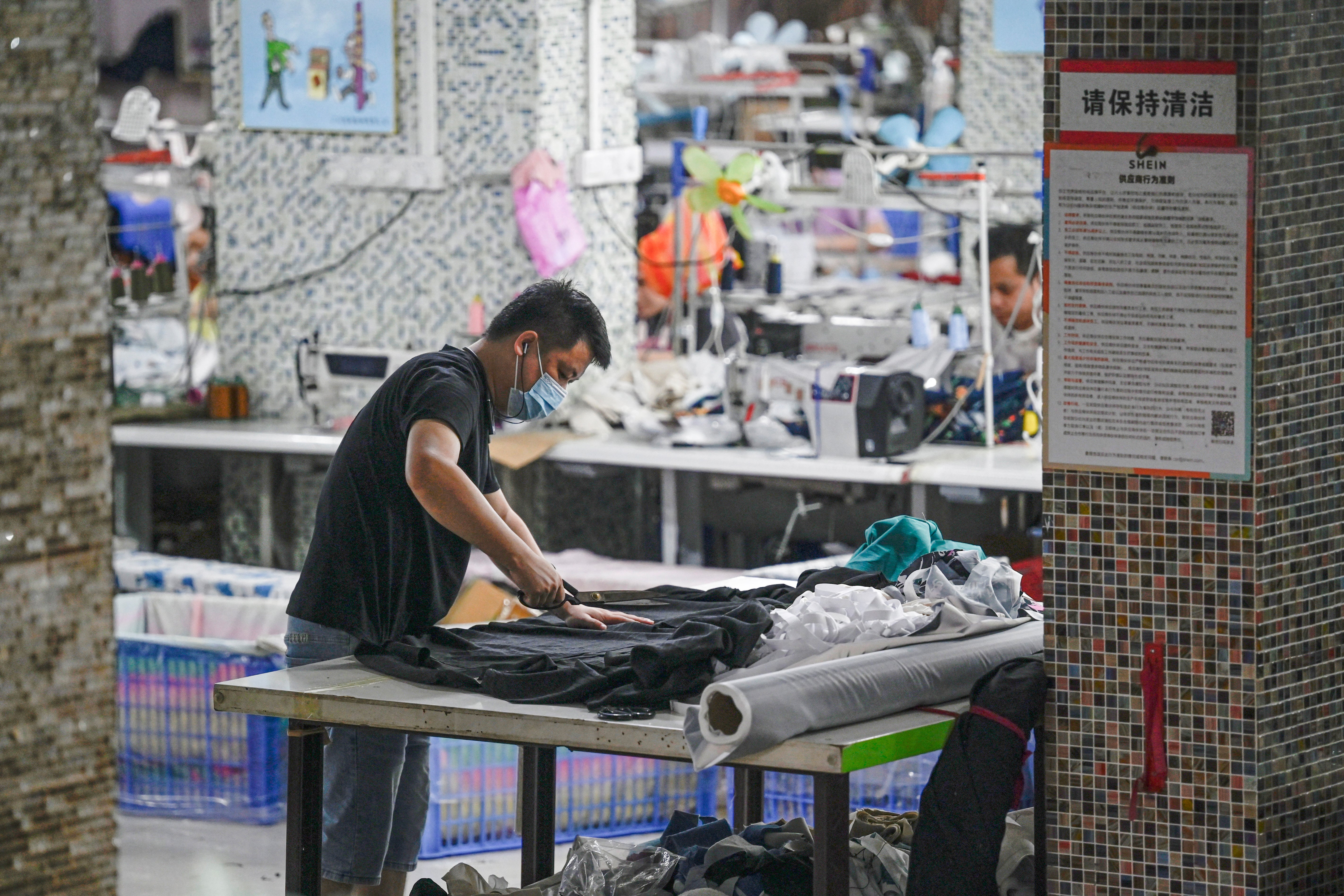 Workers at a textile factory that supplies clothes to fast fashion ecommerce company Shein in Guangzhou, 2024