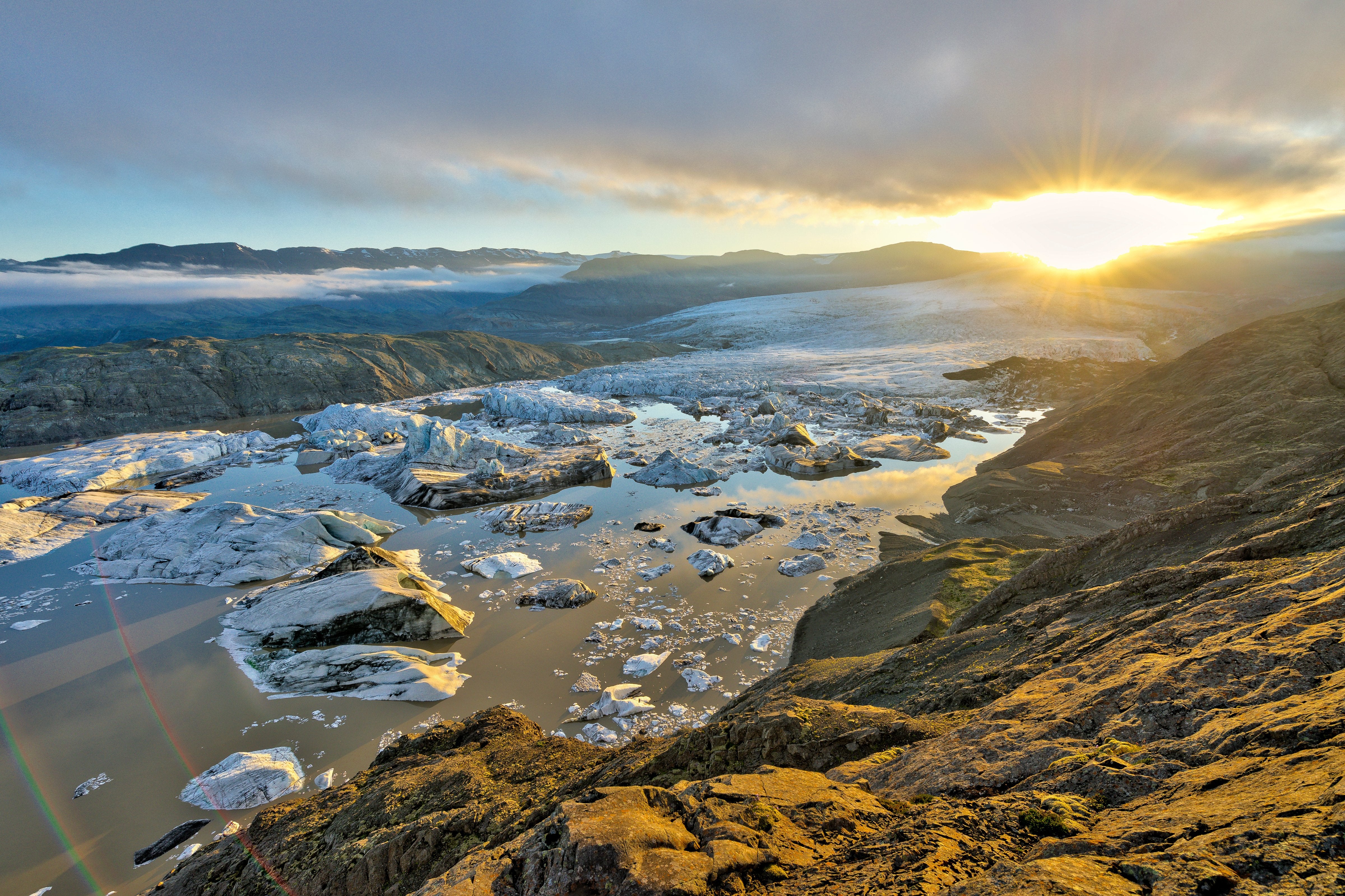 Iceland’s glaciers glisten like gemstones as the sunlight catches them
