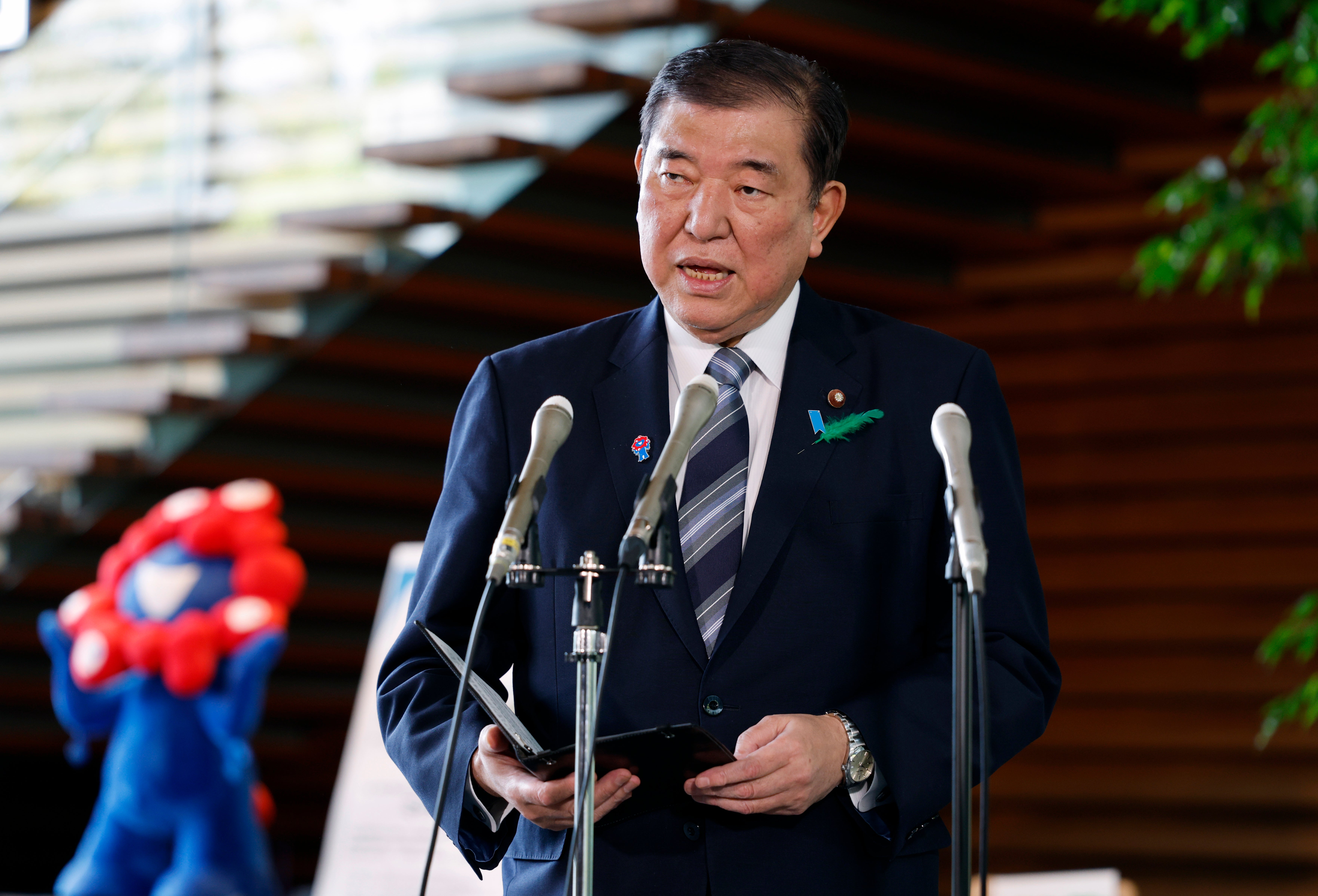 Japanese Prime Minister Shigeru Ishiba reacts to talks regarding US tariffs