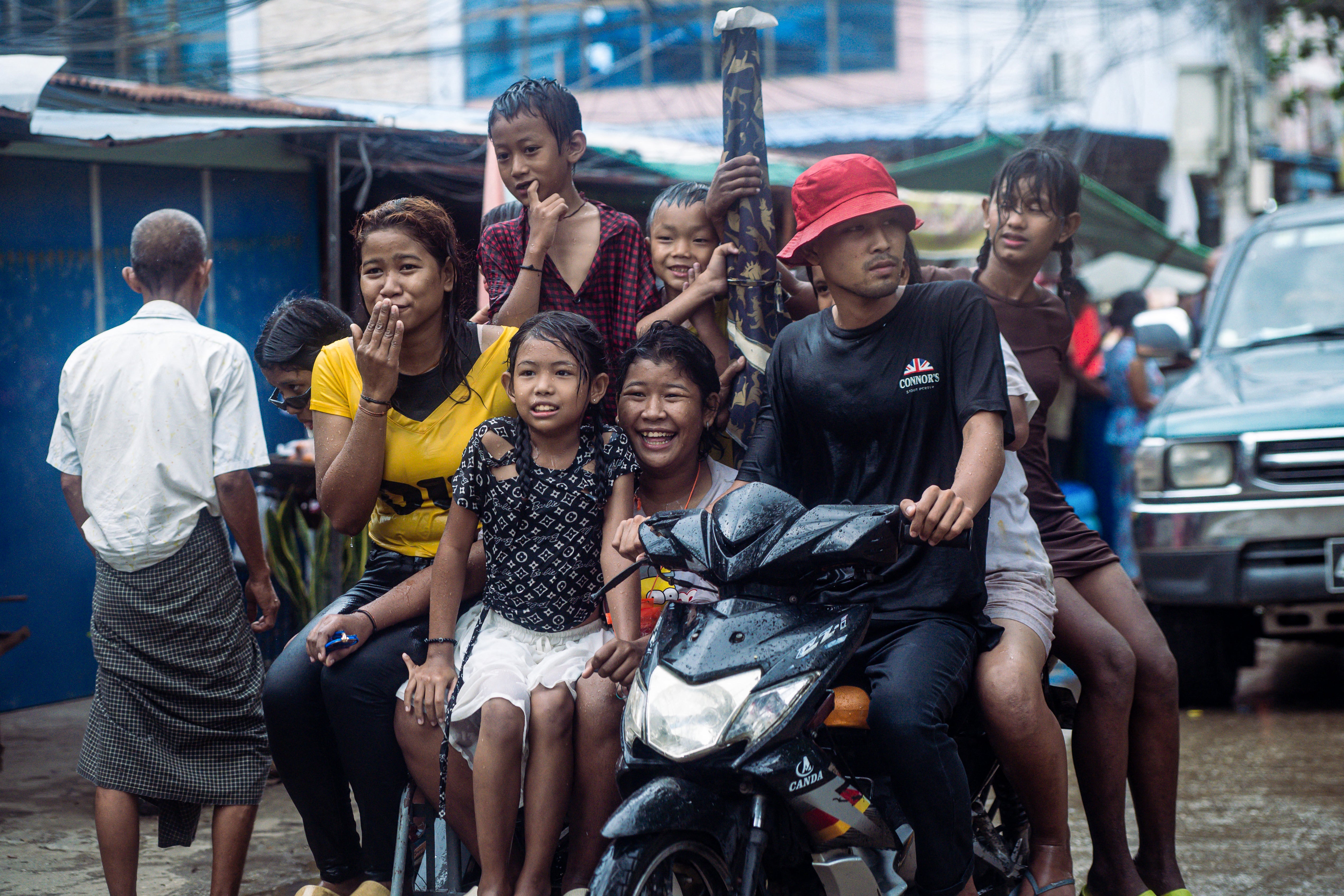 Revellers celebrate with water during Myanmar's New Year water festival, locally known as Thingyan, in Yangon on 15 April 2025