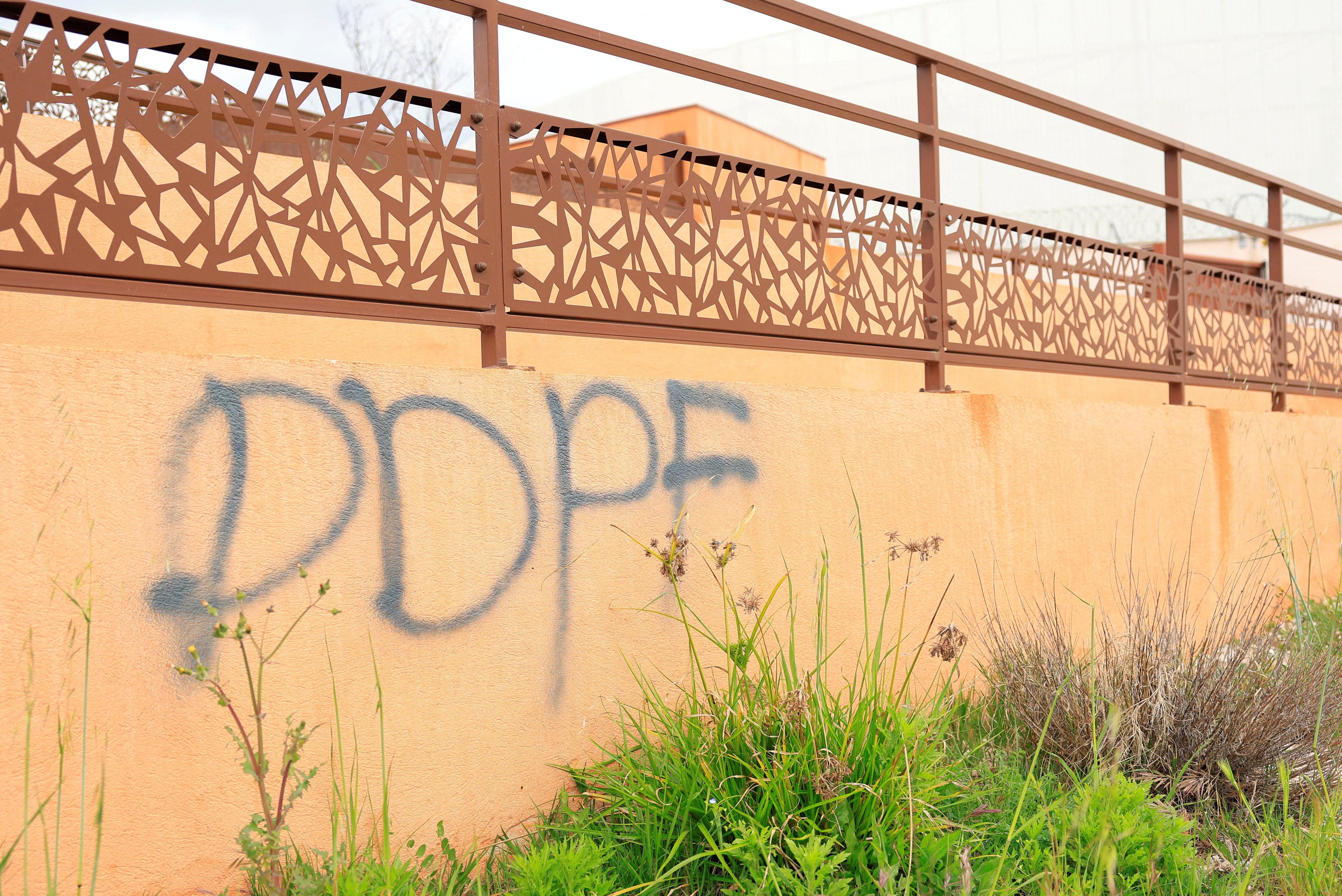 The letters 'DDPF' are seen tagged on a wall of the Aix-Luynes Penitentiary Center in Aix-en-Provence, France, April 15, 2025