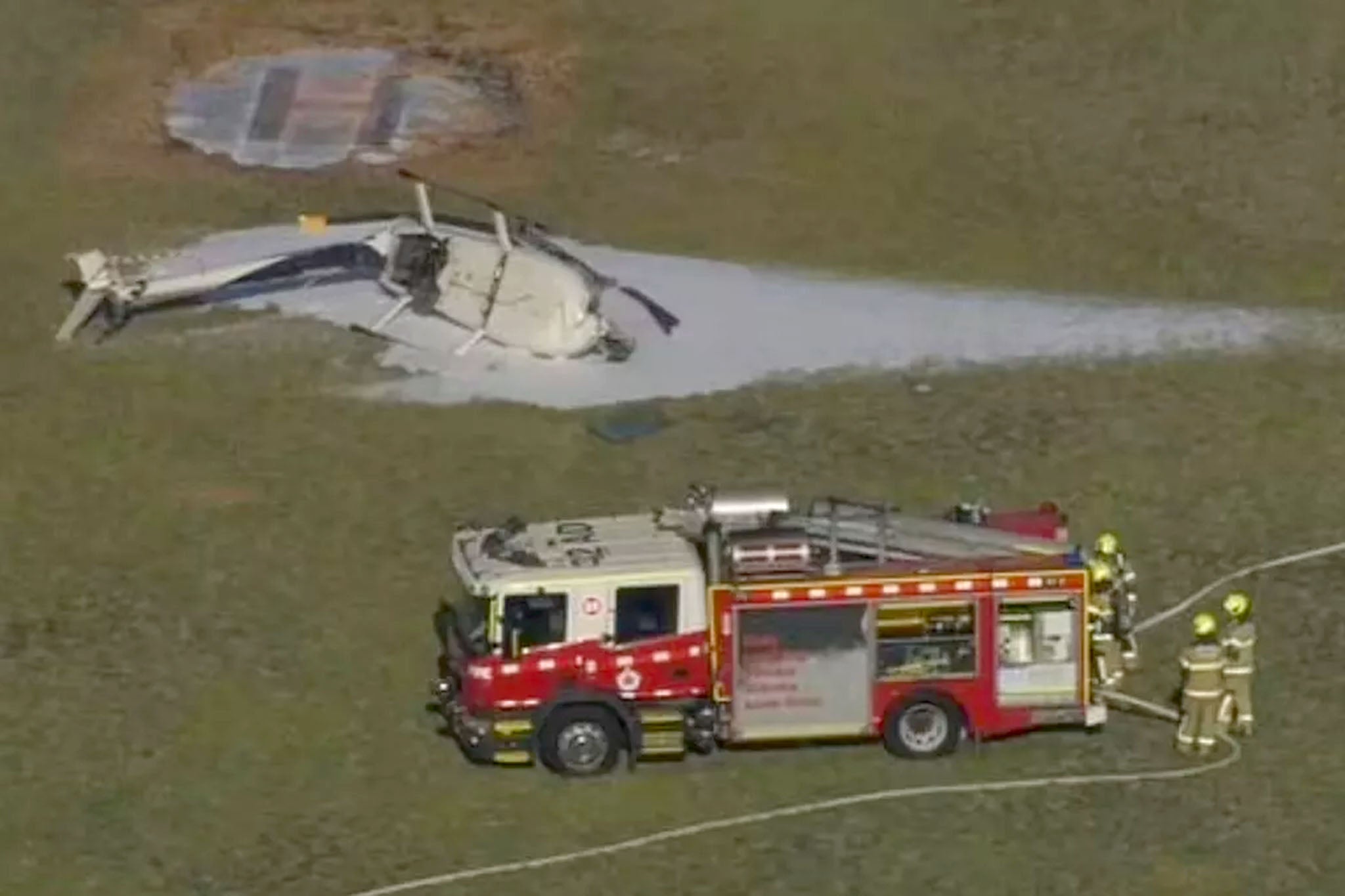 Visuals from the scene showed the crumpled remains of the helicopter doused in firefighting foam