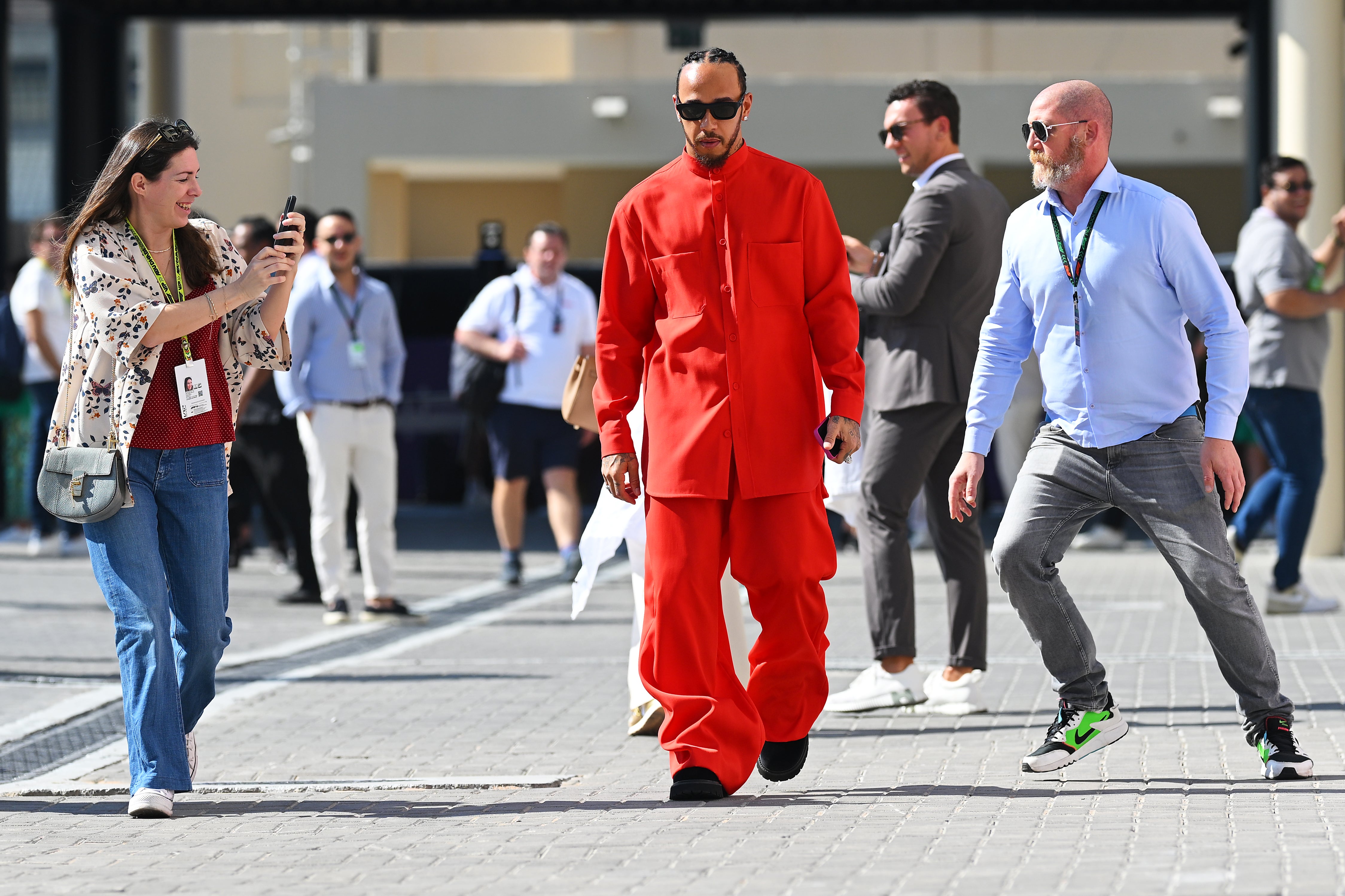 Hamilton, 40, has recently bucked the trend of drivers arriving in the F1 paddock in their team-branded kit