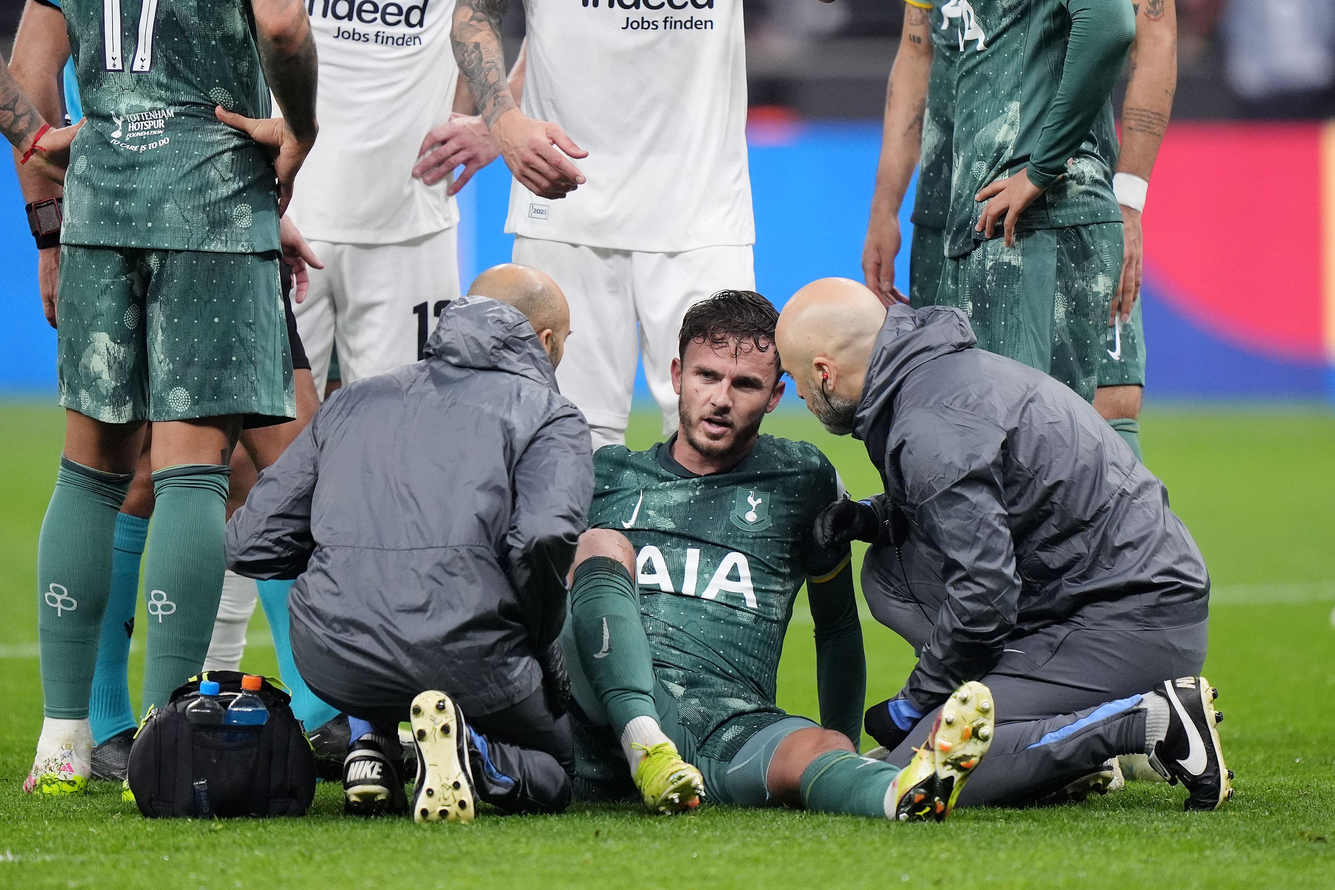 James Maddison receives treatment during Tottenham’s 1-0 win at Eintracht Frankfurt (Bradley Collyer/PA)