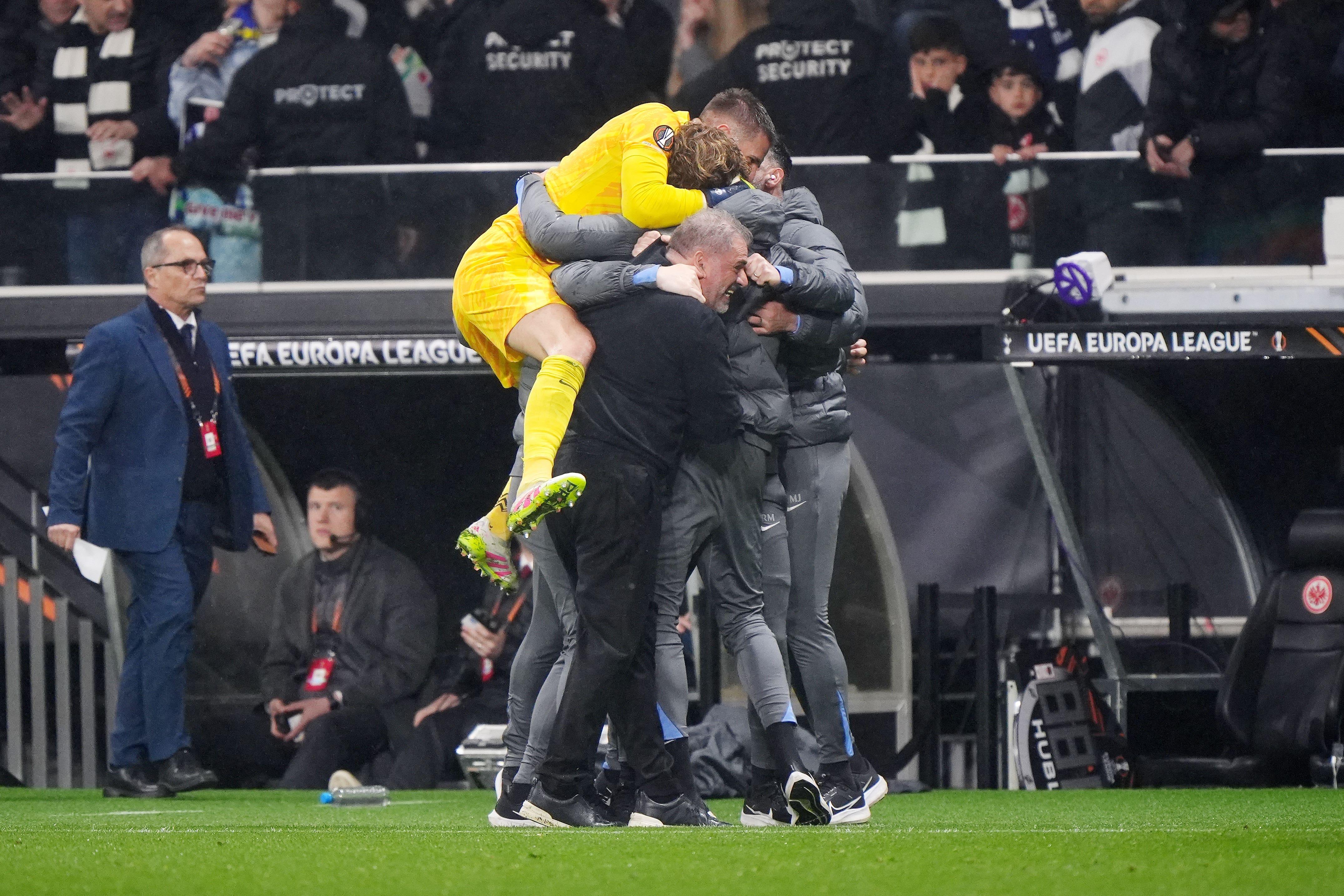 Guglielmo Vicario jumps on Tottenham boss Ange Postecoglou and his coaching staff at full-time after a 1-0 win over Eintracht Frankfurt (Bradley Collyer/PA)