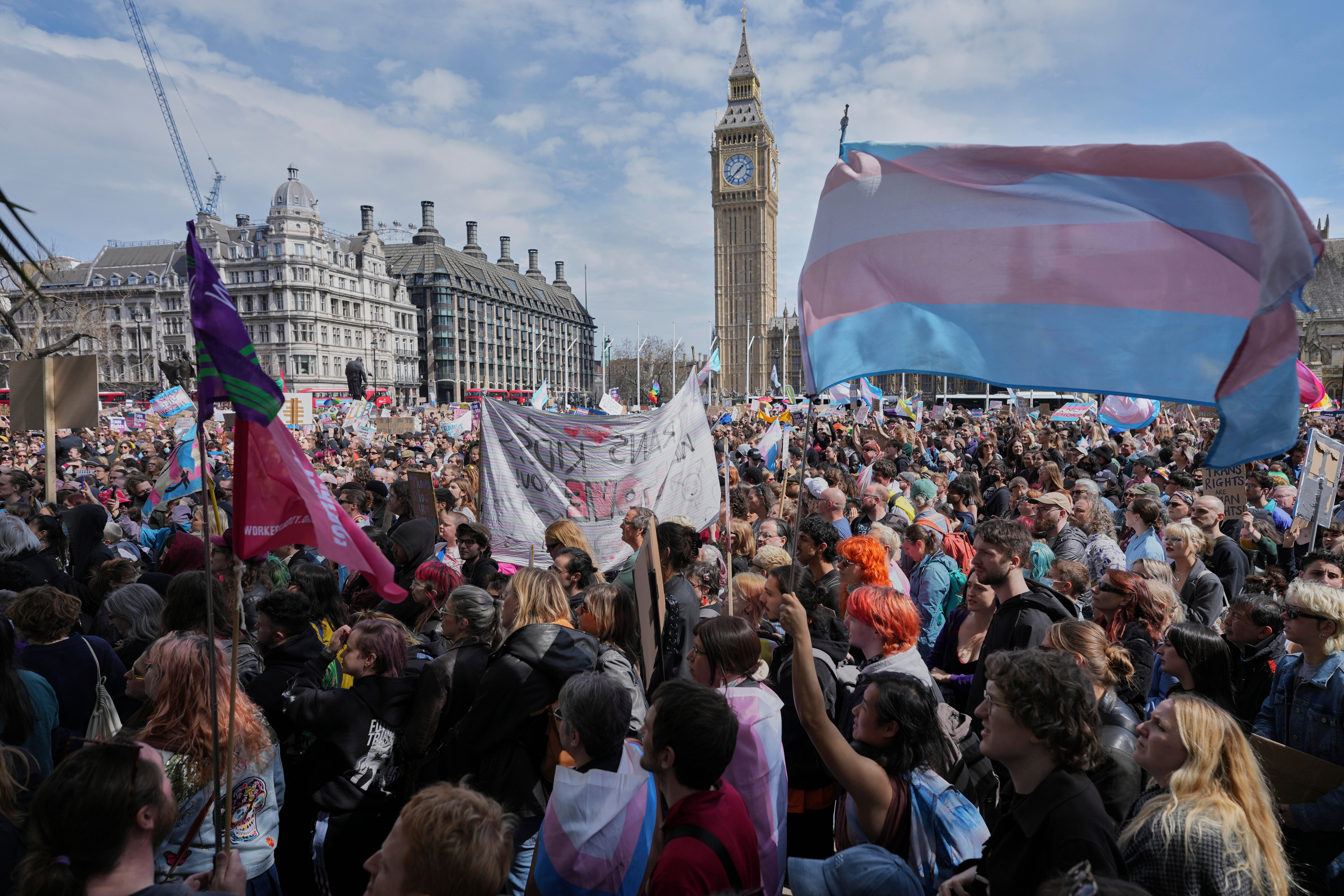 Campaigners take part in a rally organised by trans rights groups, trade unions, and community organisations following the Supreme Court ruling at Parliament Square in central London on Saturday