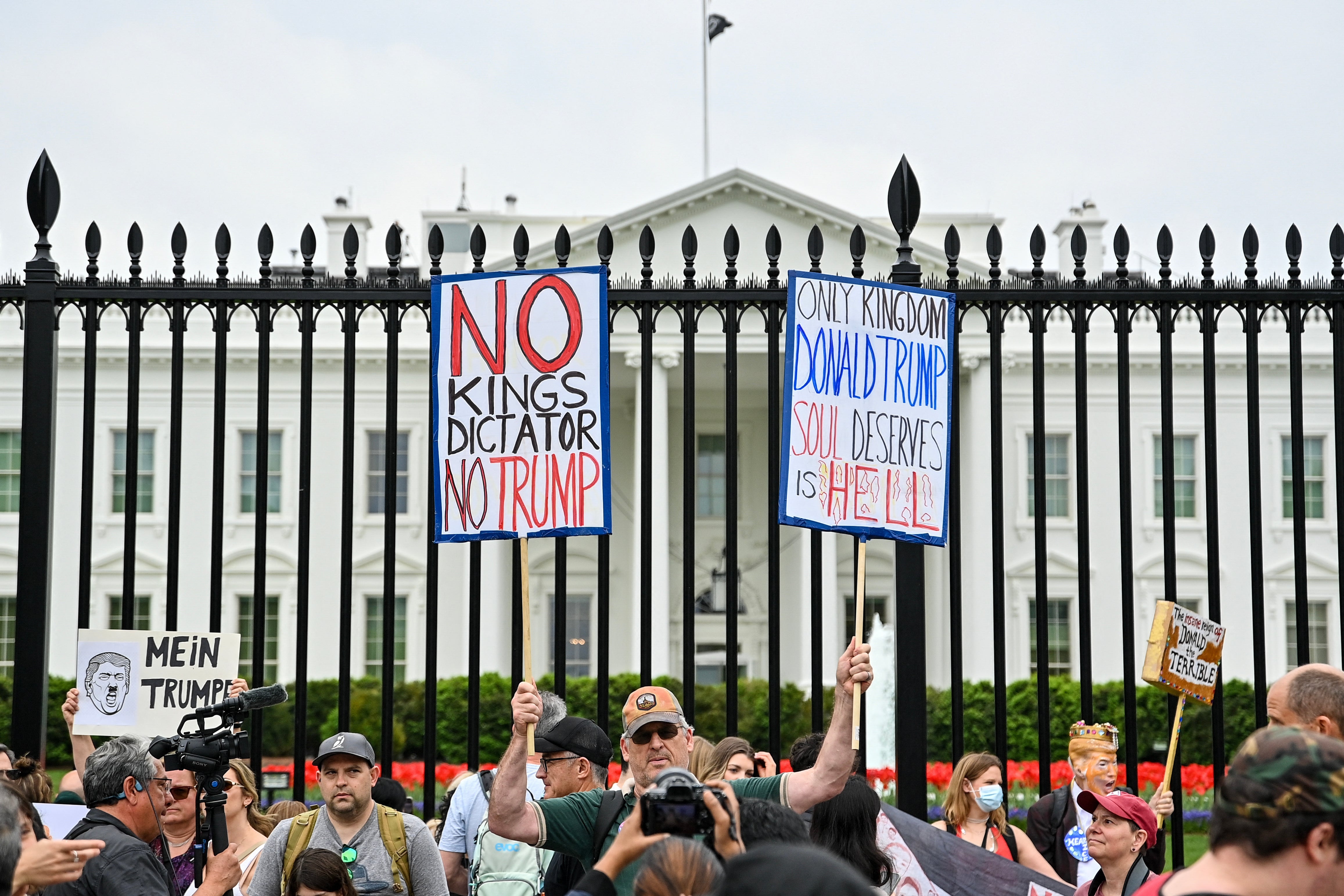 Demonstrators outside of the White House denounce Trump’s claims that he is a ‘king’