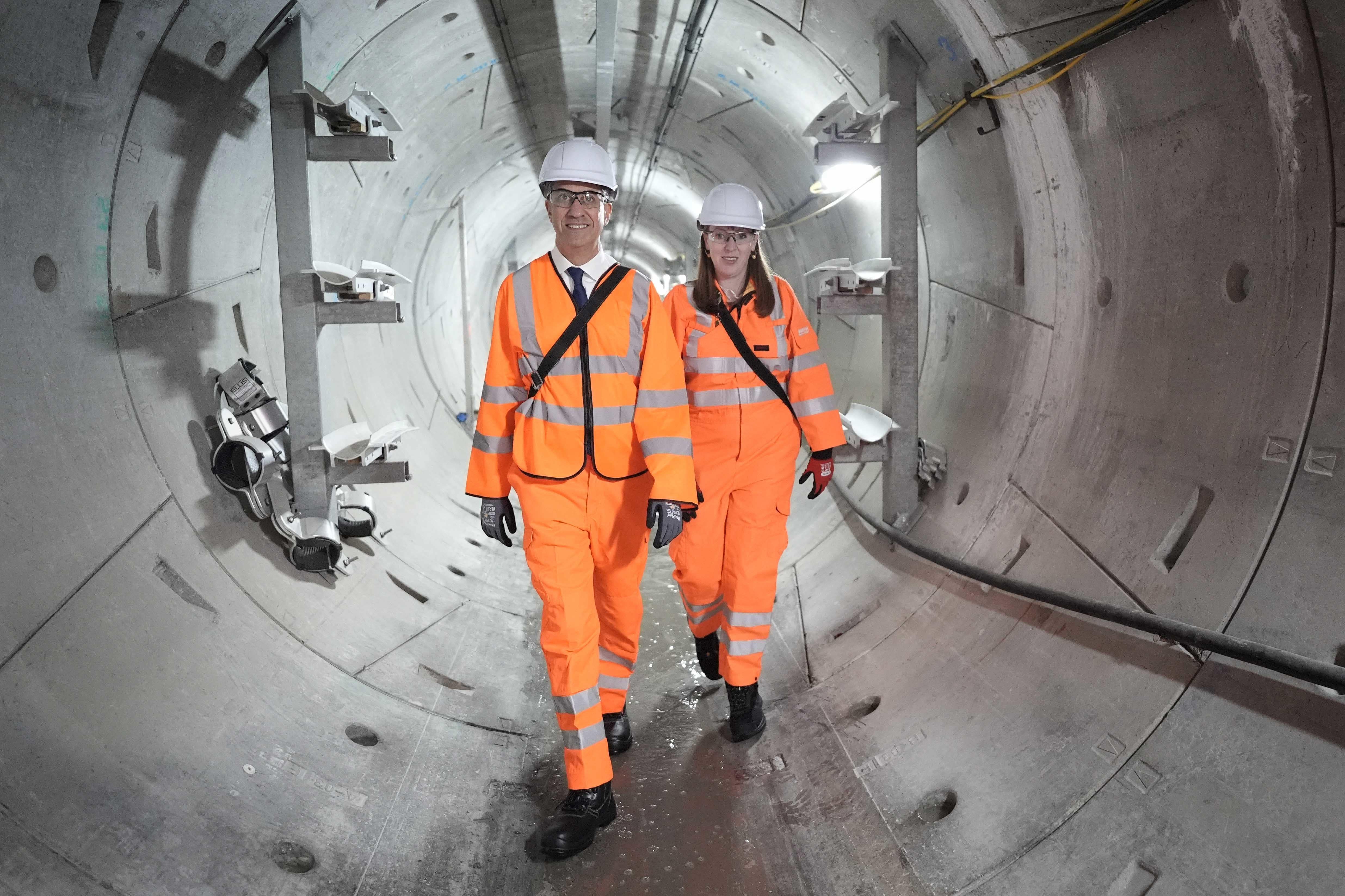 Ed Miliband, left, said Nigel Farage was peddling ‘nonsense and lies’ about net zero (Stefan Rousseau/PA)