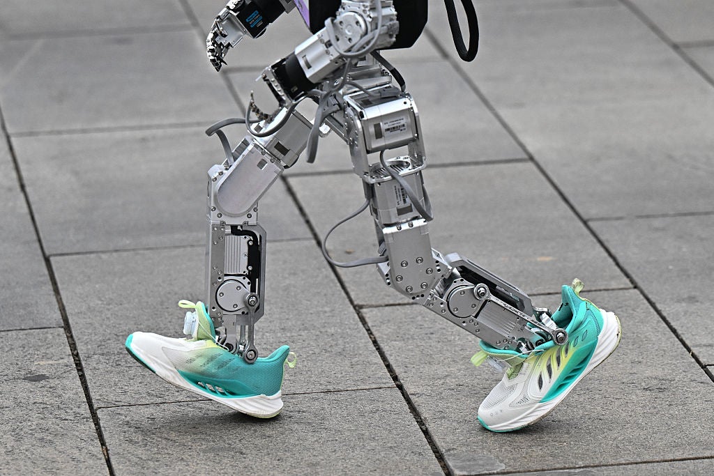 A robot runs in the humanoid robot half marathon in Beijing, joining thousands of their flesh-and-blood counterparts in a world-first half marathon showcasing China's drive to lead the global race in cutting-edge technology