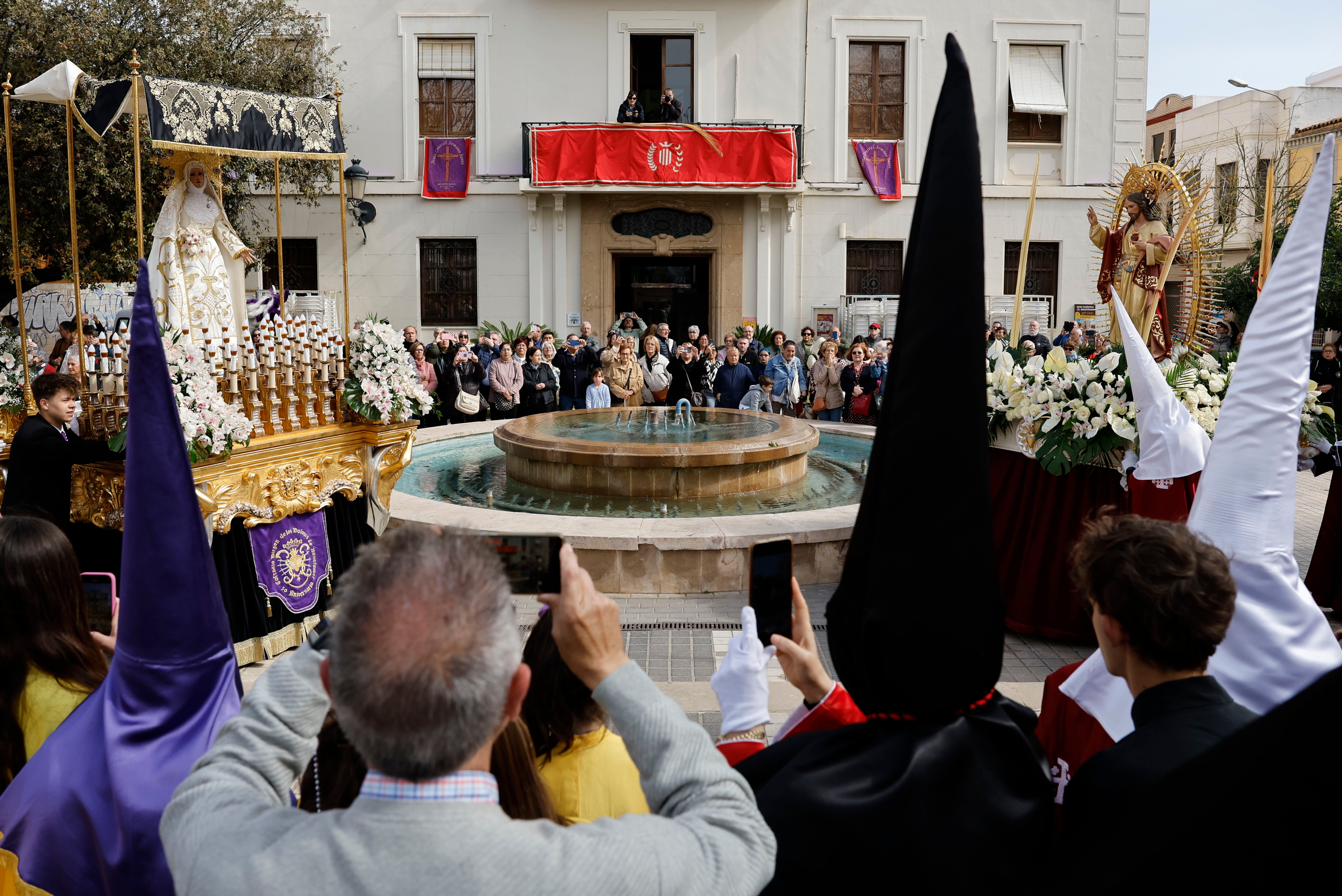 Virgin Mary and Jesus Christ floats during the 'Procession of the Meeting' as part of Easter Sunday celebrations in Benetusser town, Valencia, eastern Spain, on Sunday, at an area affected by the flash floods