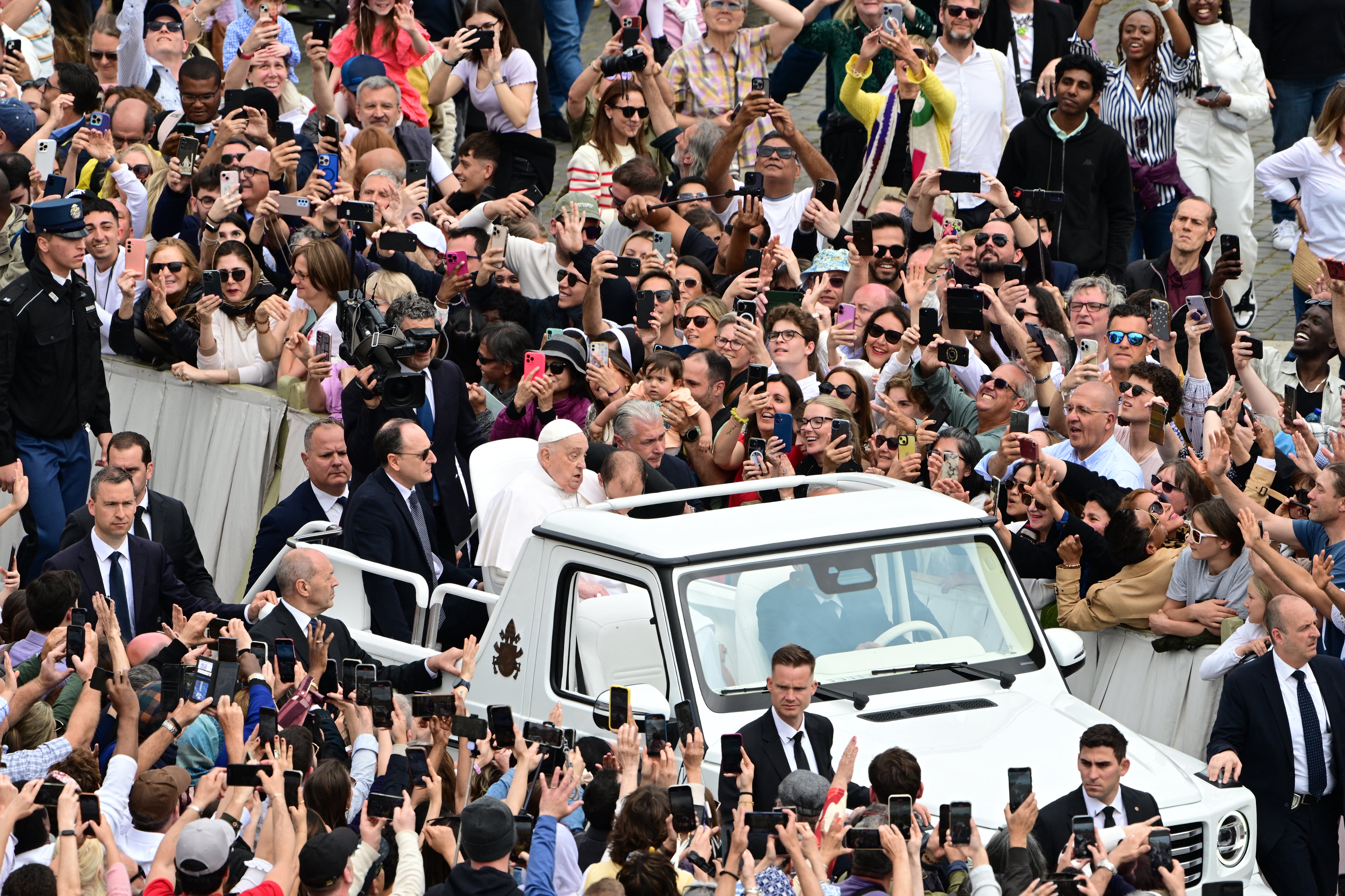 Pope Francis greets the crowd from the popemobile after the Easter mass, at St Peter's square in the Vatican on Sunday