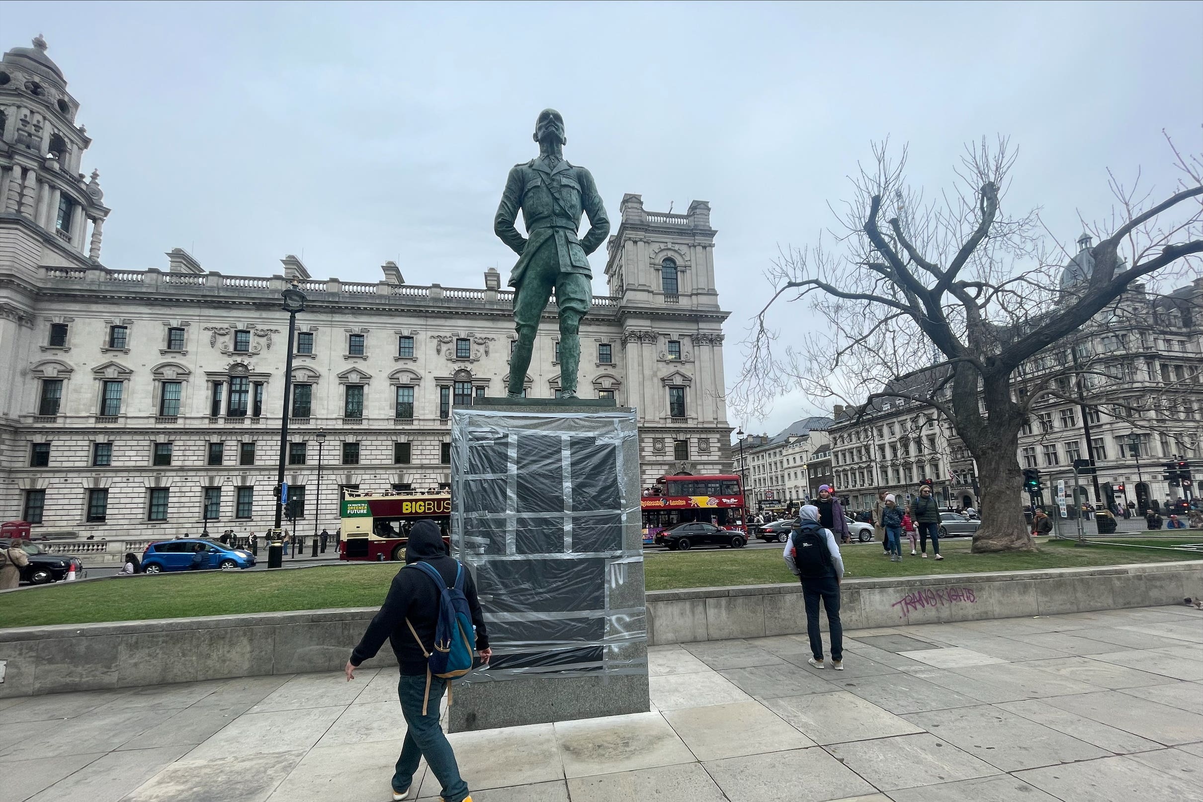 Taped plastic sheeting covers graffiti left on a statue of Jan Christian Smuts in Parliament Square, London (George Lithgow/PA)