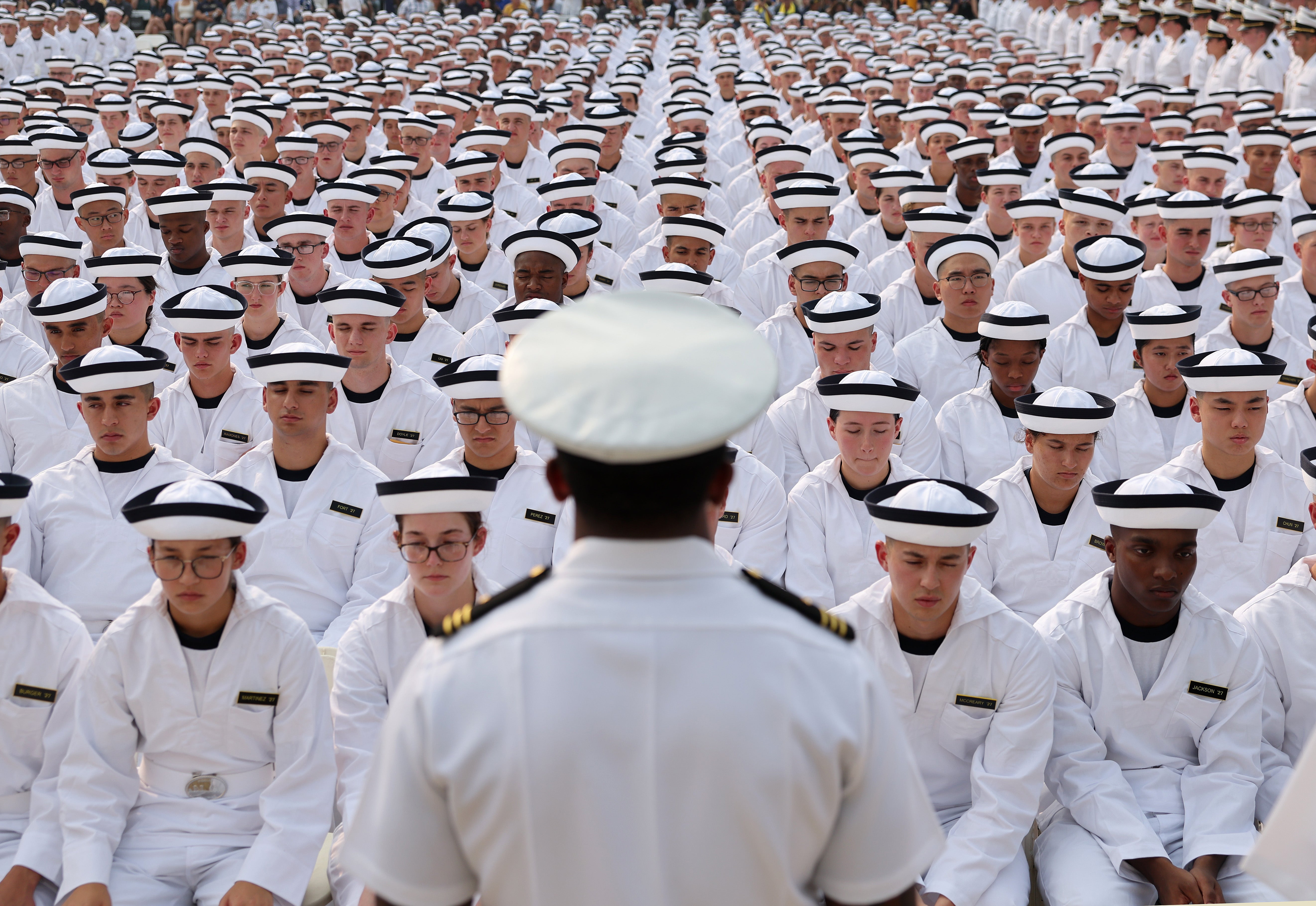 Incoming freshmen take part in their Oath of Office Ceremony during Induction Day at the U.S. Naval Academy in June 2023. Author Ryan Holiday was scheduled to speak to the entire sophomore class until the school's leaders discovered he planned to reference the nearly 400 books that were banned from the academy's library