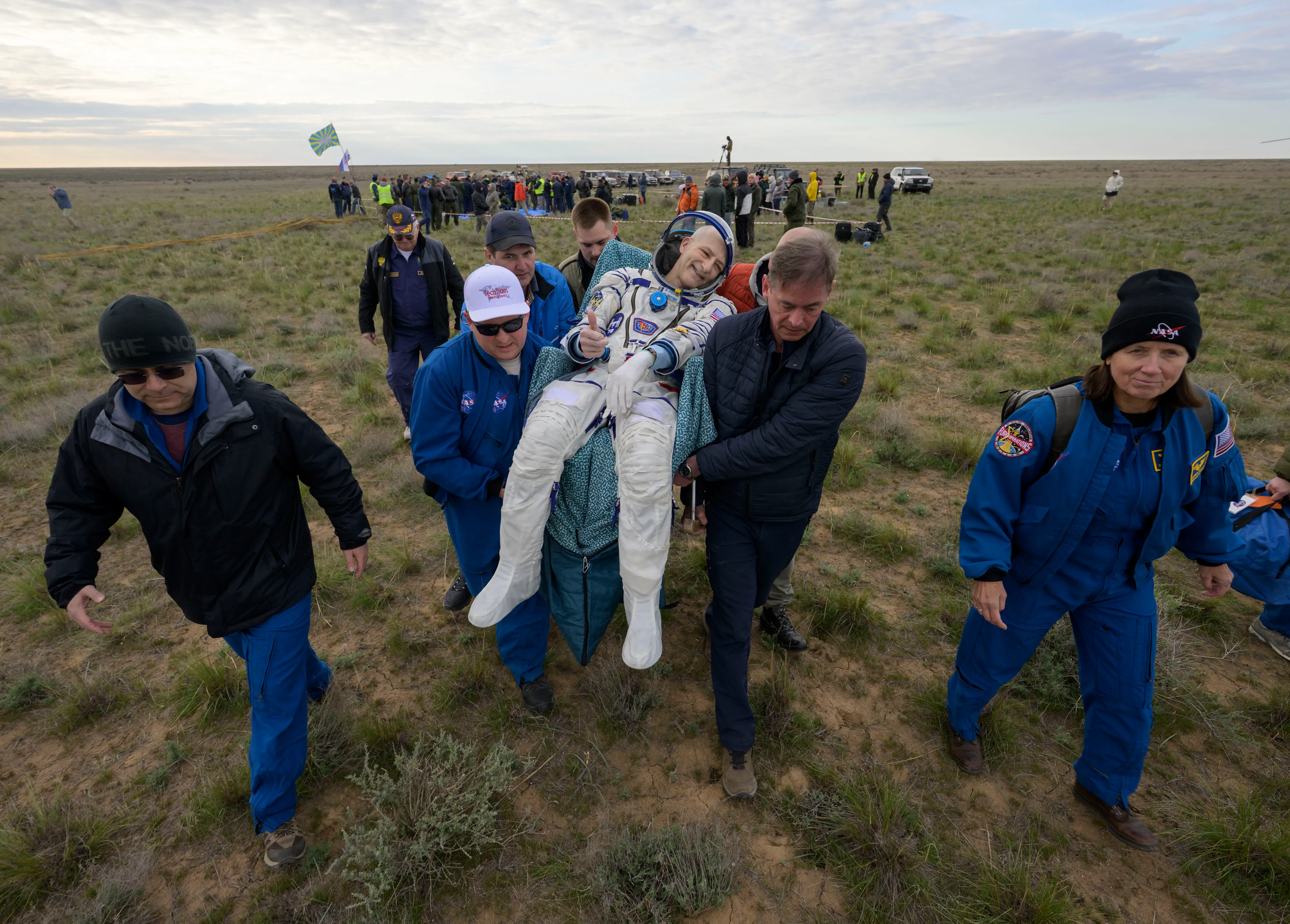 Nasa astronaut Don Pettit is carried to a medical tent shortly after return to Earth