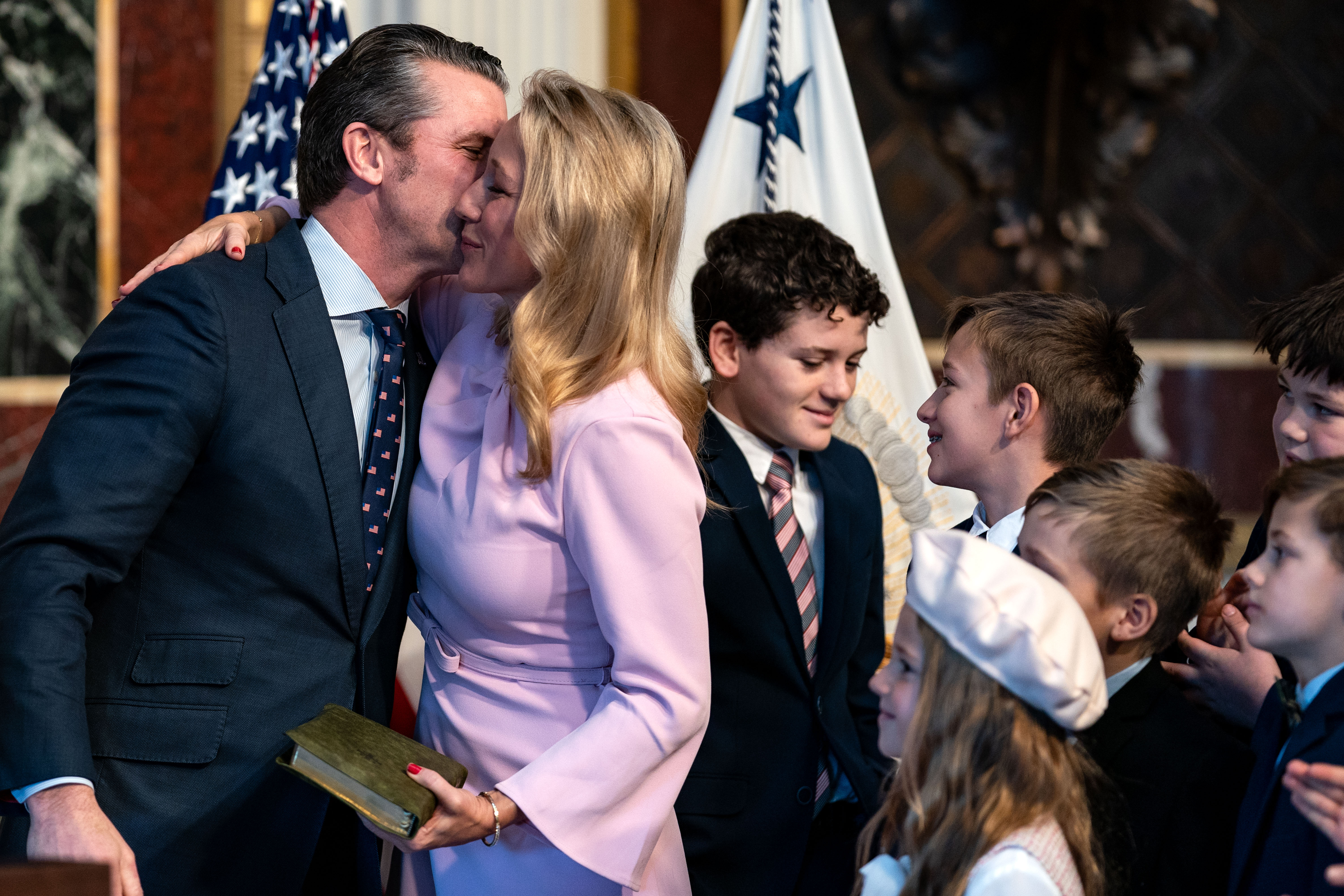 The couple embrace after his swearing in as defense secretary. It is not clear why Hegseth’s wife would need to know about upcoming military strikes