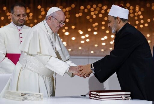 Pope Francis greets Sheikh Ahmed el-Tayeb, the grand imam of Egypt's Al-Azhar