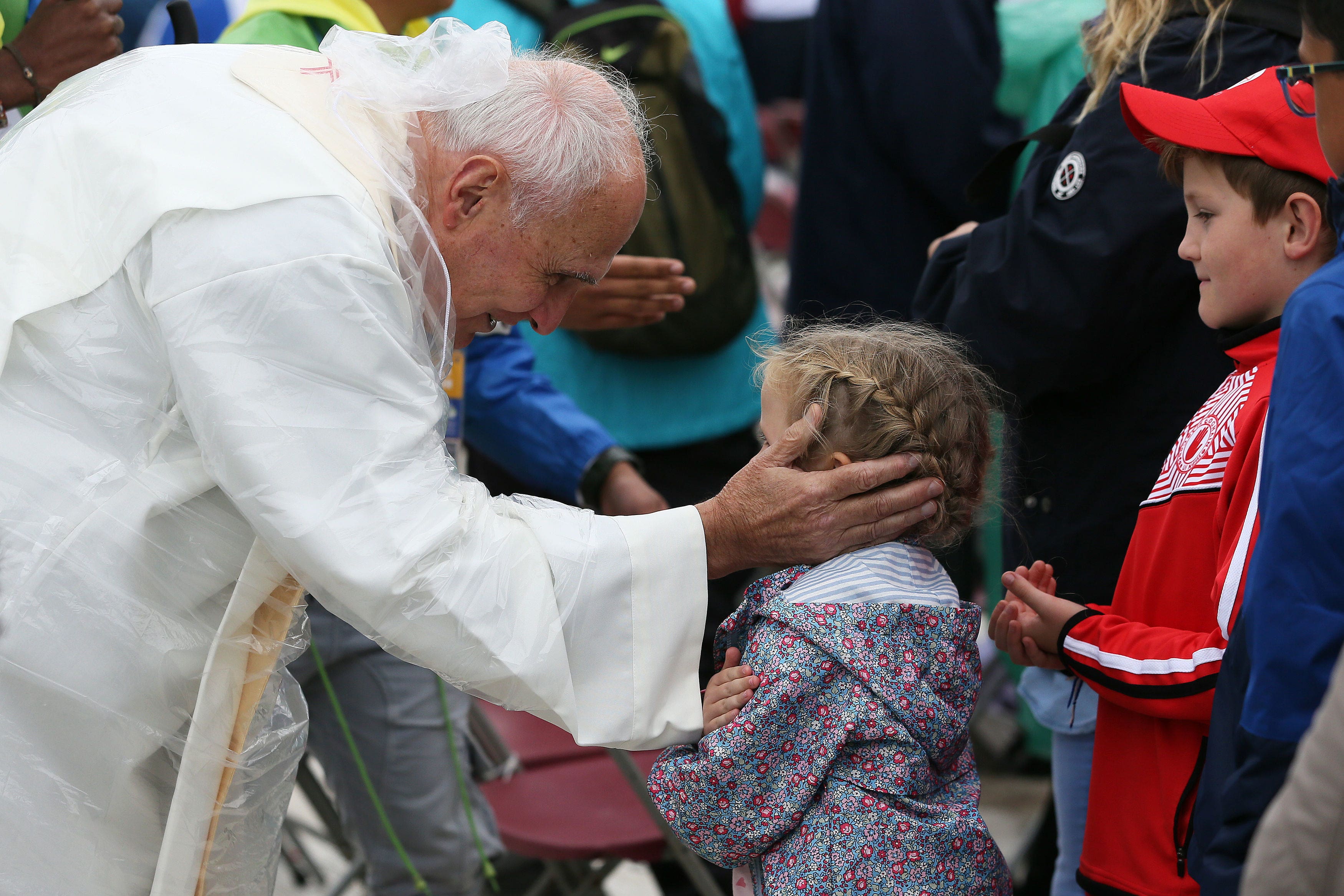 Children queuing for communion during Pope Francis’ closing Mass at the World Meeting of Families in Dublin’s Phoenix park in 2018 (Brian Lawless/PA)