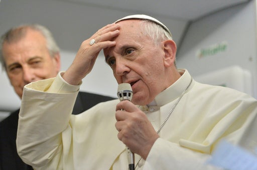 Pope Francis speaks during a news conference aboard the papal flight on its way back from Brazil in 2013