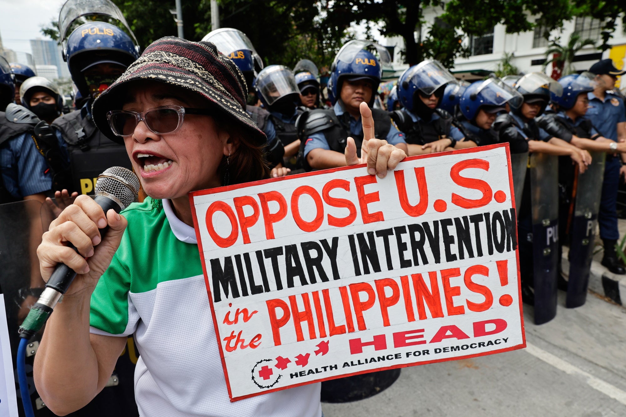A protester holds a sign during a rally in Manila