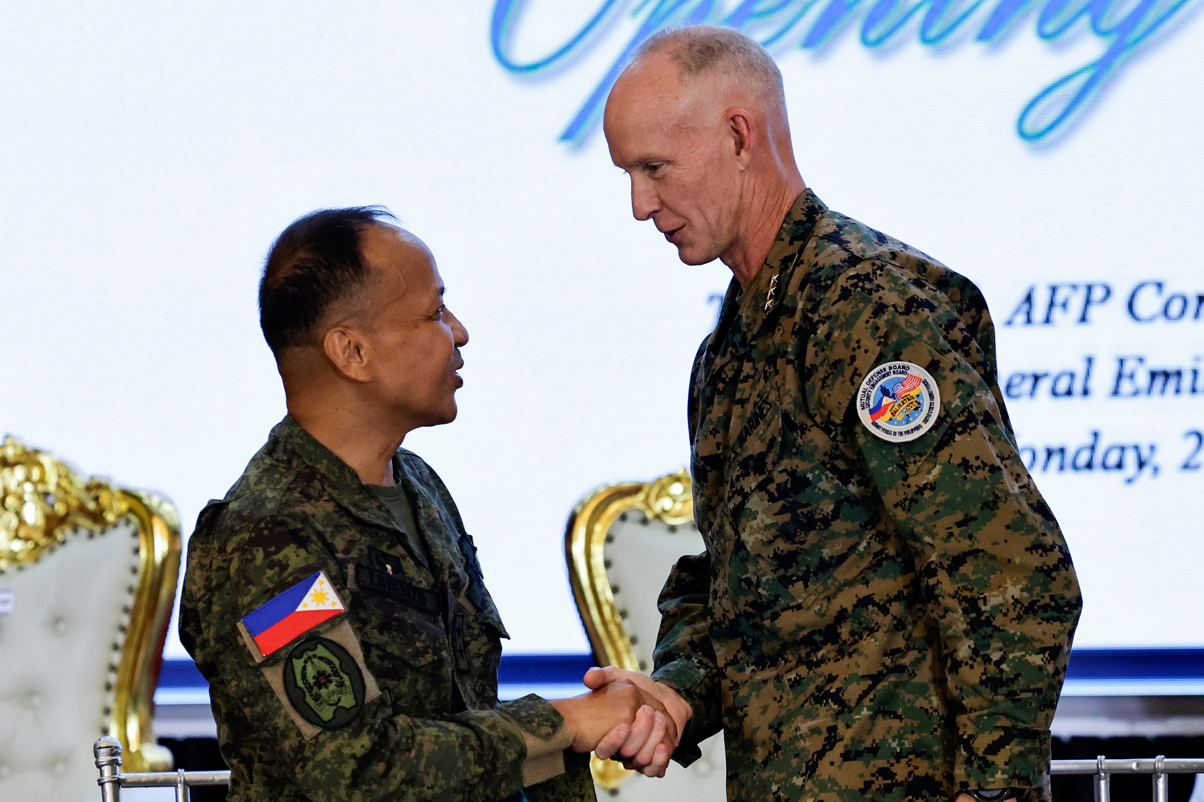 Major General Francisco Lorenzo and Lieutenant General James Glynn shake hands after launching the Balikatan exercises