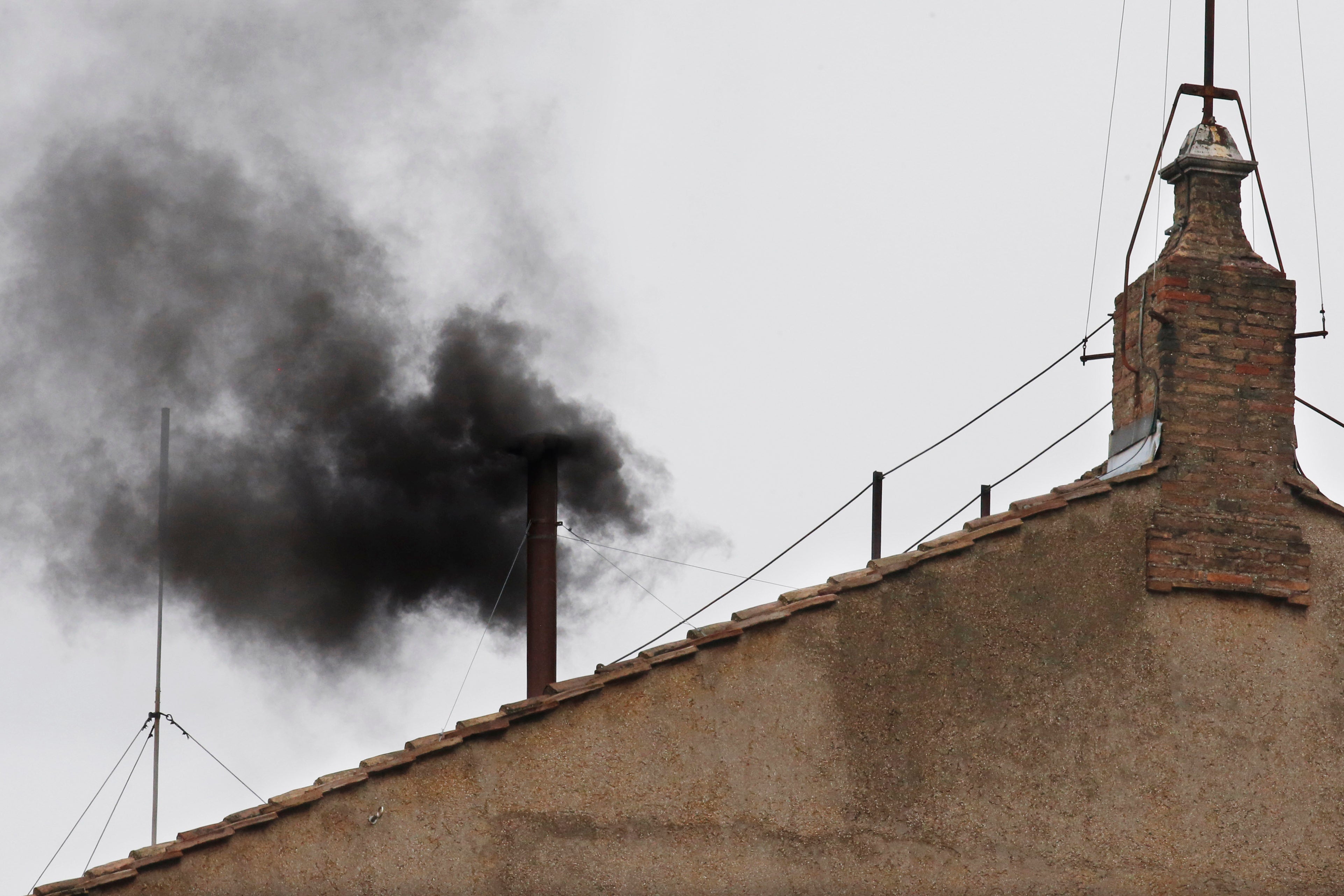 Black smoke emerges from the chimney on the Sistine Chapel as cardinals voted on the second day of the conclave to elect a pope in St. Peter's Square at the Vatican, Wednesday, March 13, 2013. (AP Photo/Michael Sohn, File) Next Explainer