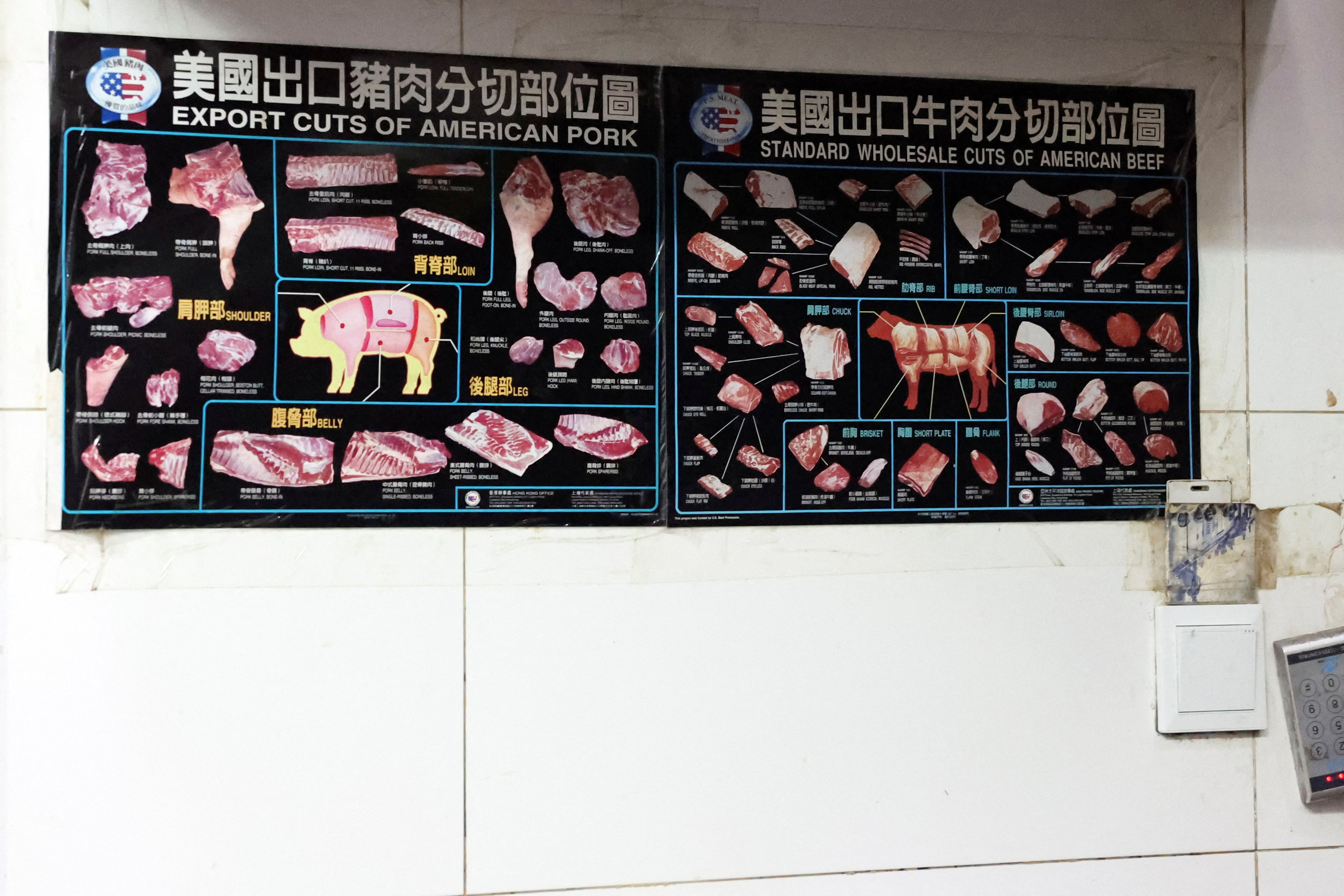 Posters showing cuts of U.S. pork and beef are displayed in the kitchen at Home Plate BBQ, an American-style restaurant, in Beijing, China April 17, 2025. REUTERS/Tiffany Le