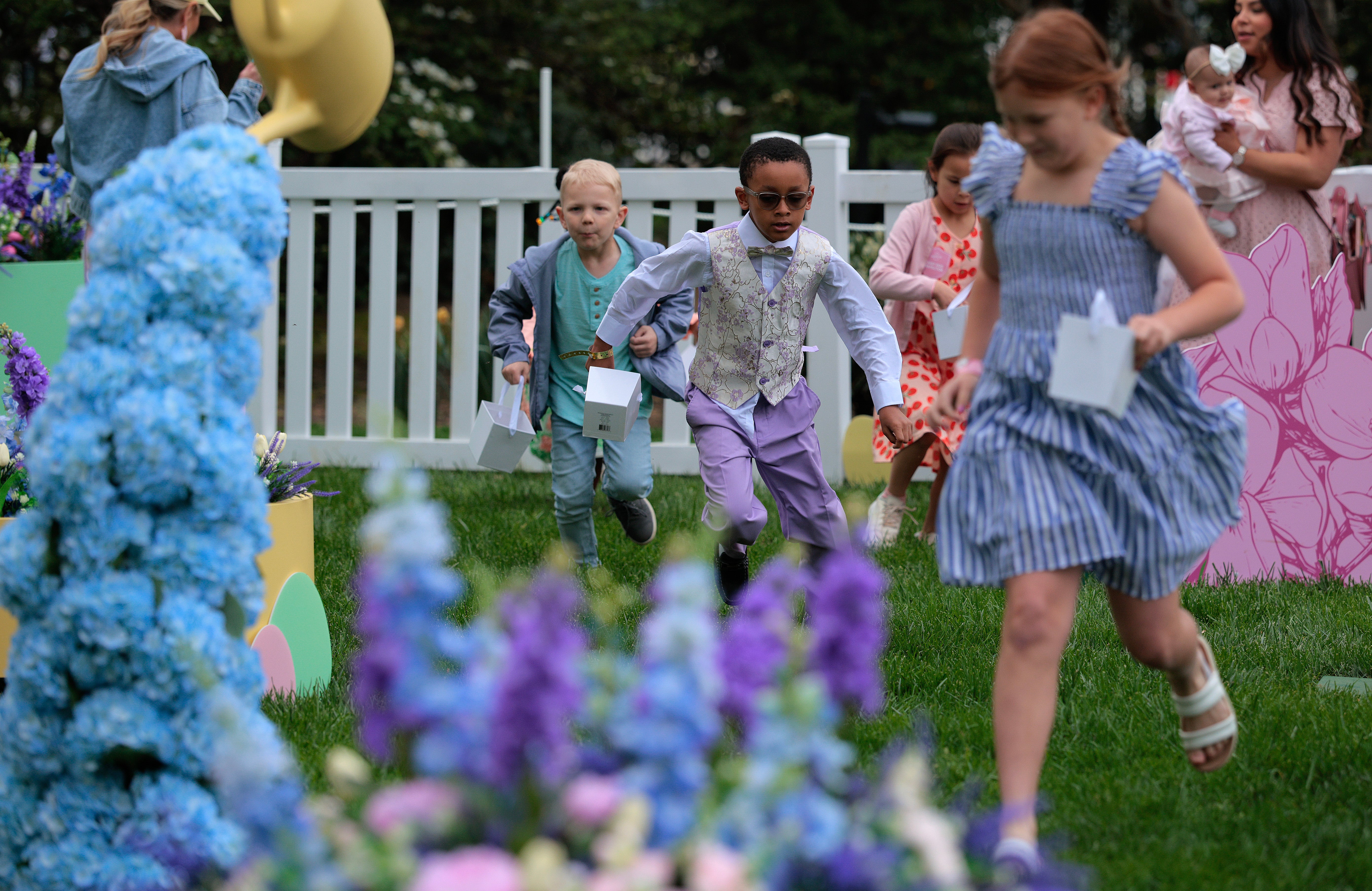Children participated in the ‘egg hunt’ ahead of Trump’s arrival. The planning of the event has traditionally been the task of first ladies, with the egg roll races being introduced by Pat Nixon