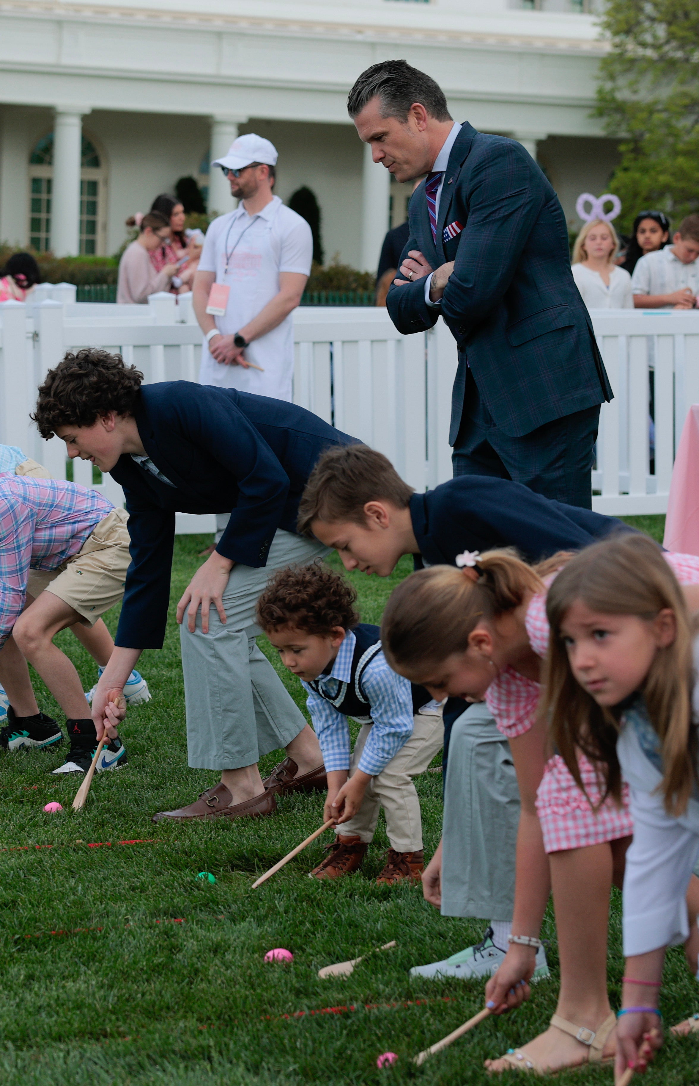 Defense Secretary Pete Hegseth watched as children participated in the Easter Egg Roll, which, according to some accounts, dates back to the presidency of Abraham Lincoln ahead of its official start in 1878